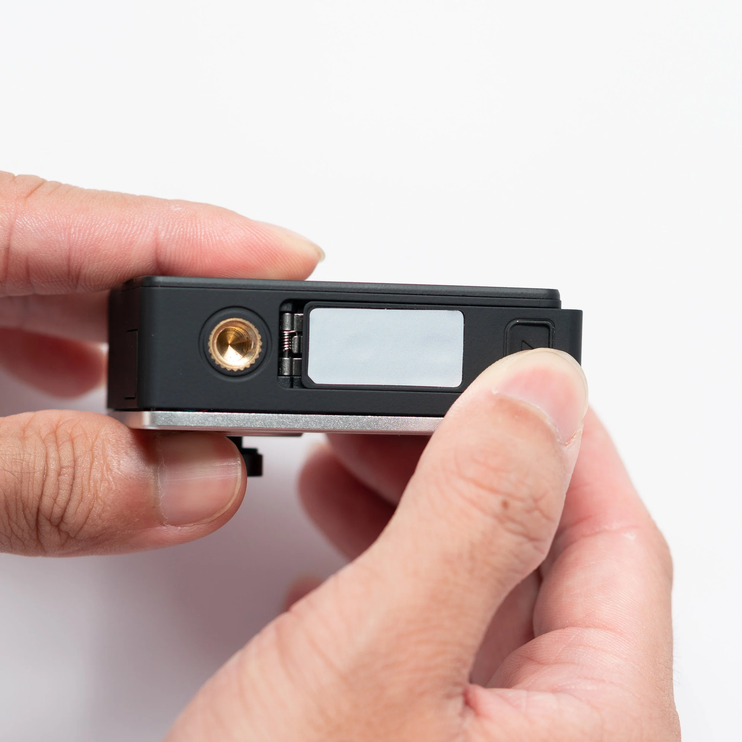 2. Open the battery door by sliding it in the direction of the arrow
