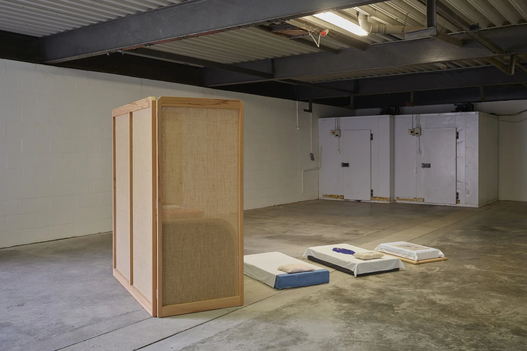   Aleana Egan ,  lit-clos , 2026. Beech frame, hessian, wool, linen, various dyed cotton and muslin fabrics, latex, pigment, shell, foam, copper (four parts), 180 x 160 x 390 cm. Installation view, Interface, Inagh. Courtesy of the artist and Kerlin 