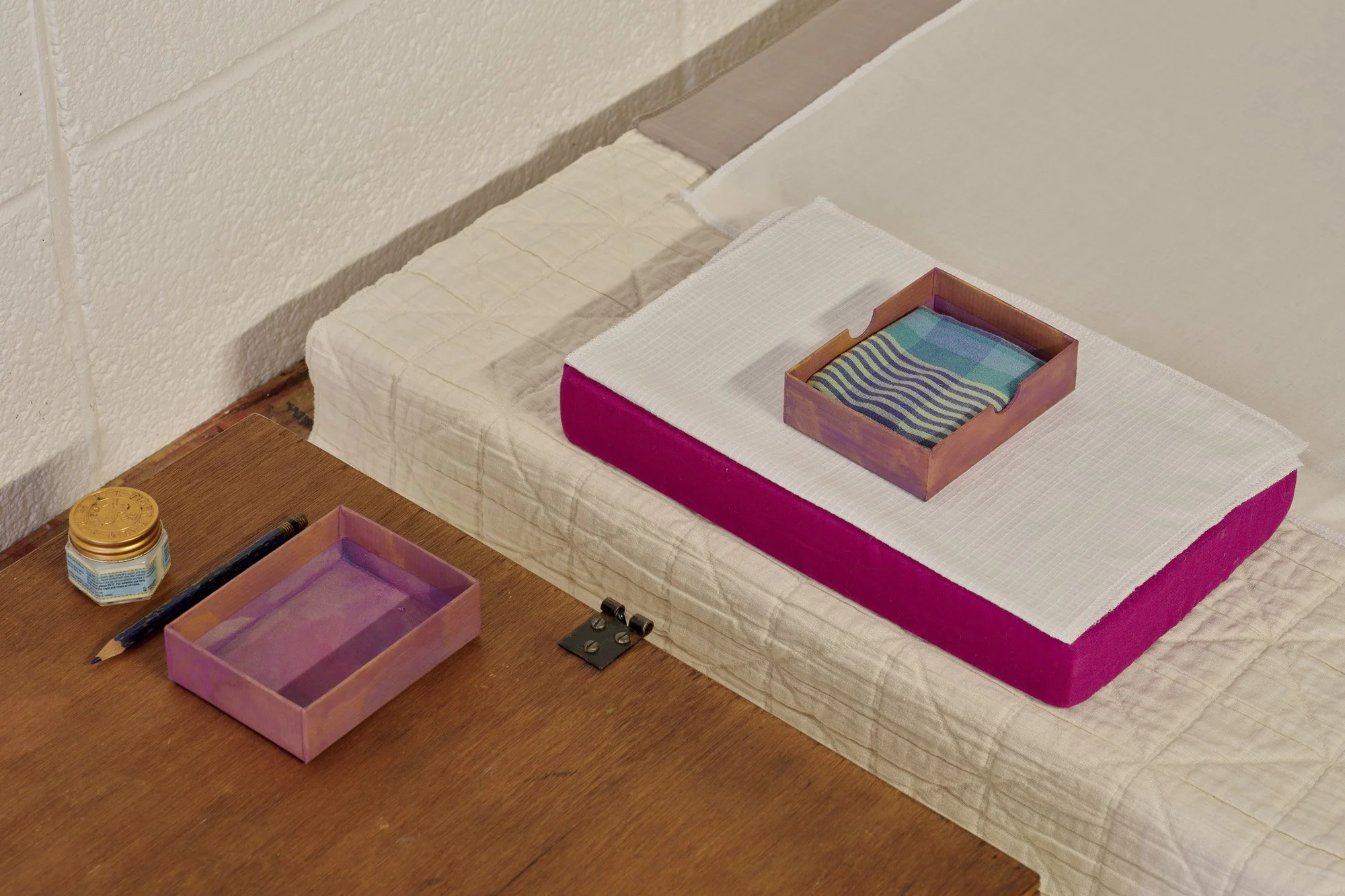   Aleana Egan ,  Bruno , 2026 (detail). Wooden box, pencil, tiger balm, foam, card, cotton, linen, wood, 27 x 75 x 160 cm. Installation view, Interface, Inagh. Courtesy of the artist and Kerlin Gallery. Photograph by Ros Kavanagh. 
