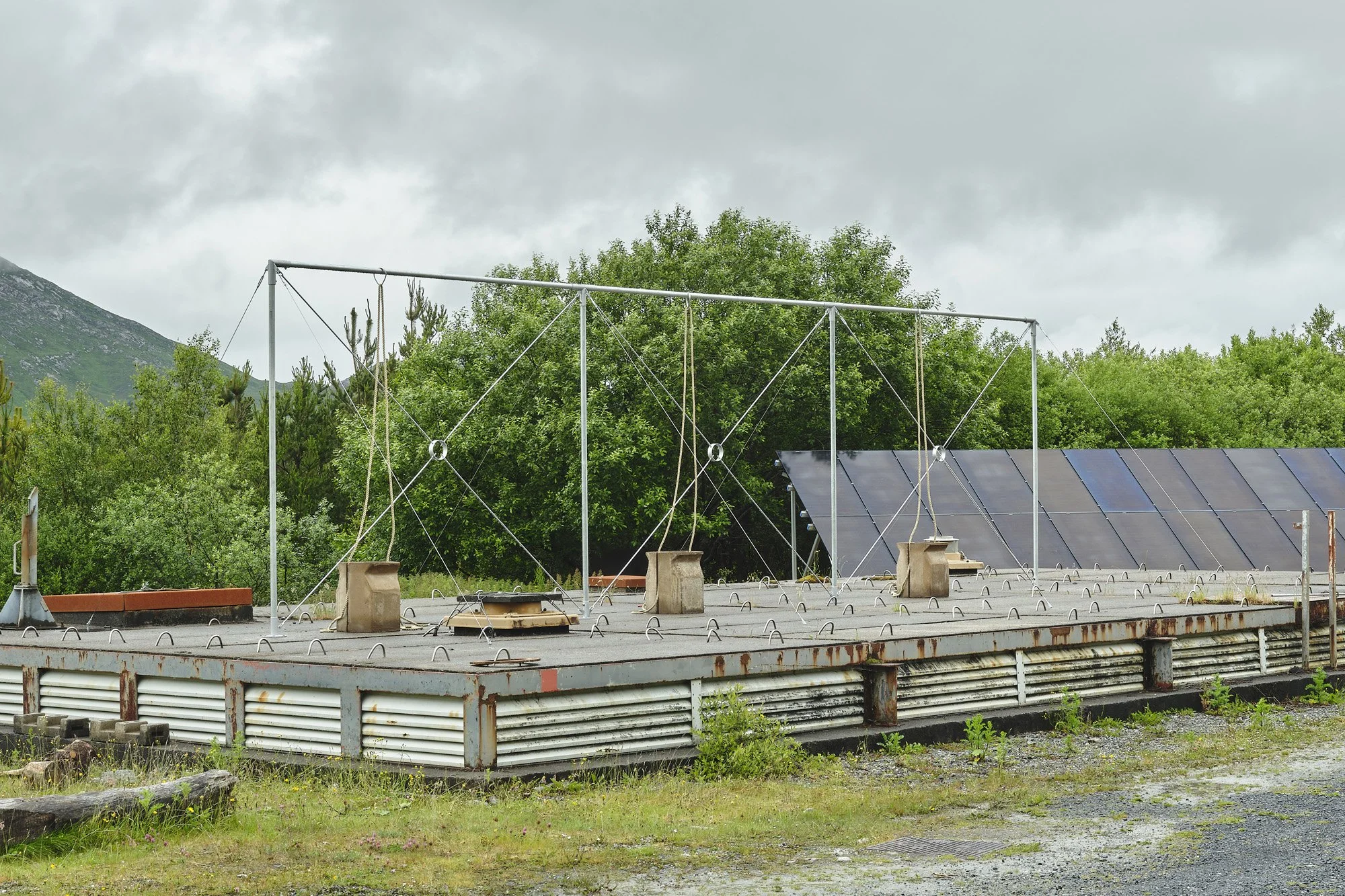   Aleana Egan ,  earlier things , 2026. Galvanised steel, hemp rope, fire backs, 300 x 1070 x 510 cm. Installation view, Interface, Inagh. Courtesy of the artist and Kerlin Gallery. Photograph by Ros Kavanagh. 