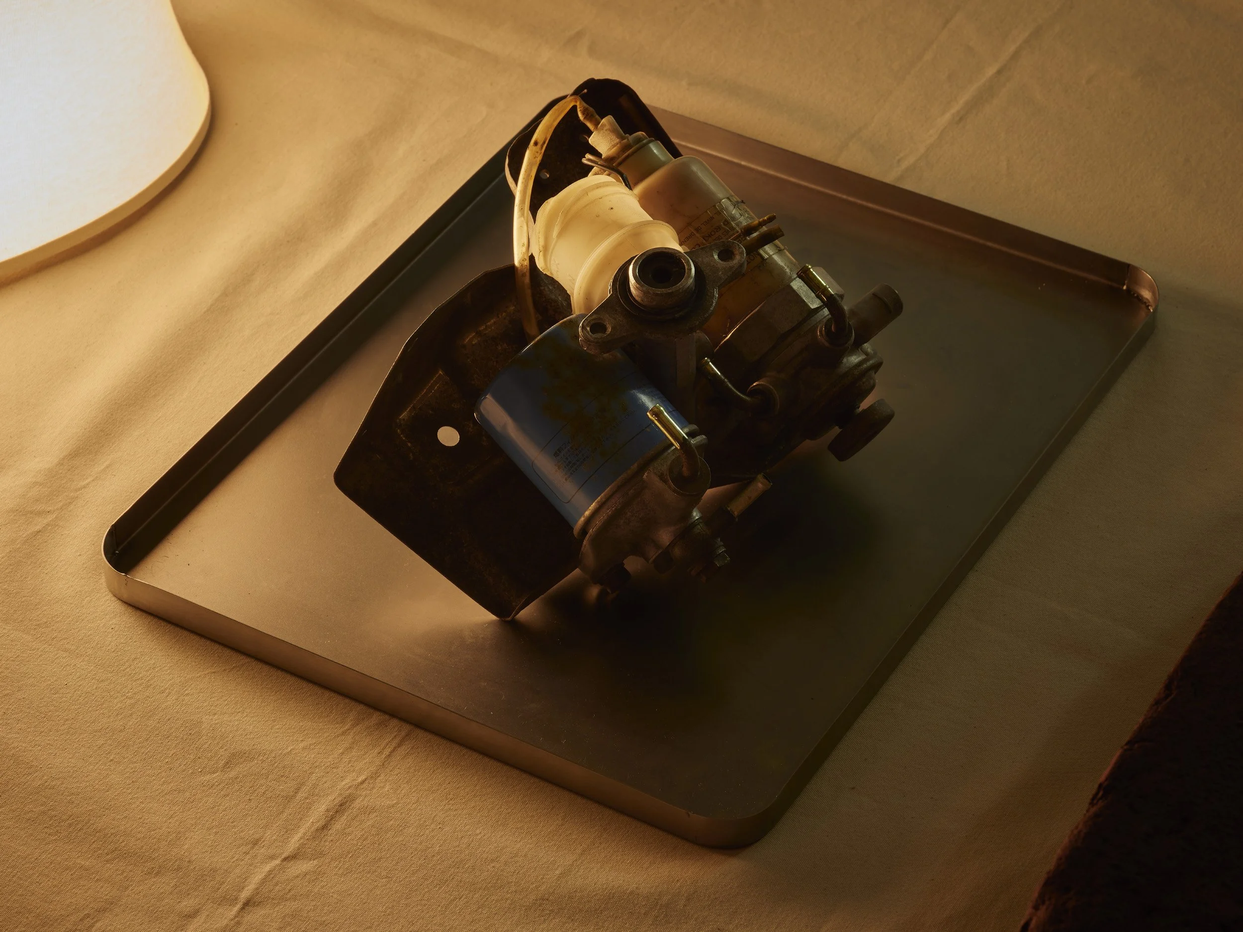   Aleana Egan ,  remote sense (Isuzu Trooper) , 2019 (detail). Steel, engine parts, canvas, polystyrene, light fixing, 26 x 196 x 116 cm. Installation view, Interface, Inagh. Courtesy of the artist and Konrad Fischer Galerie. Photograph by Ros Kavana