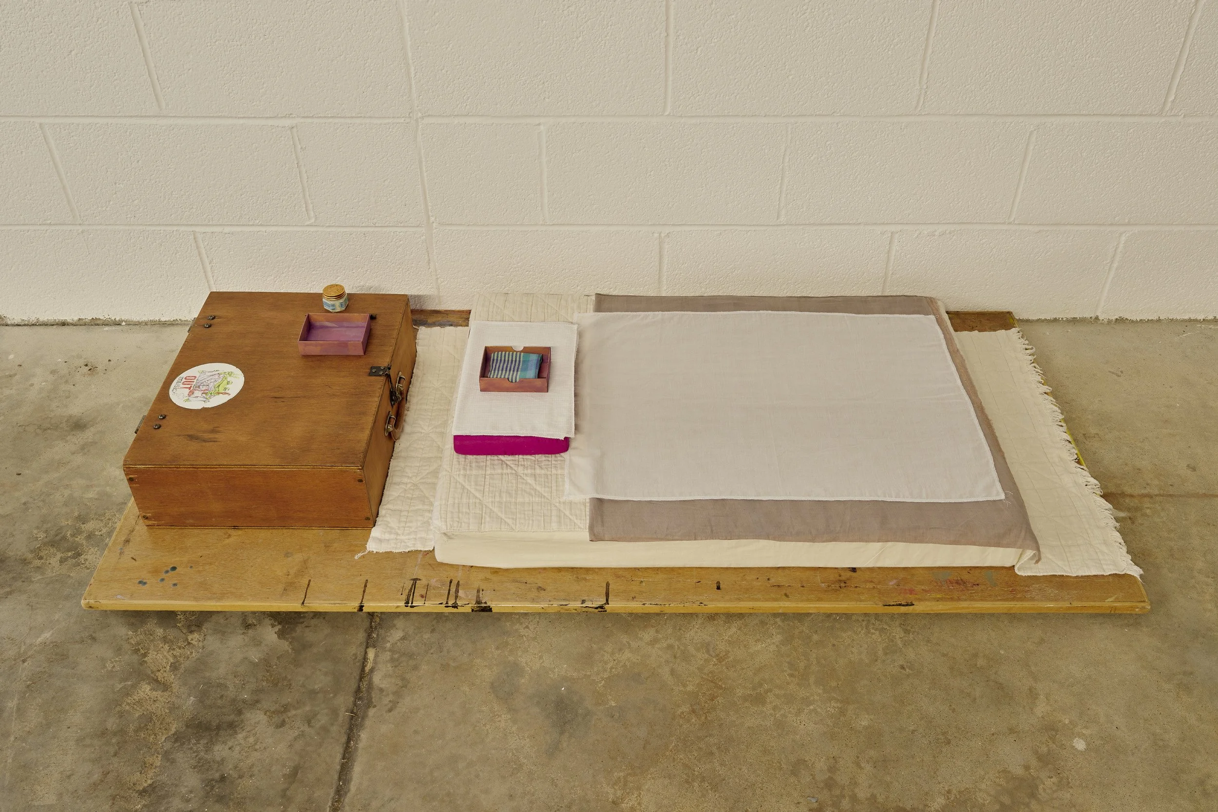   Aleana Egan ,  Bruno , 2026. Wooden box, pencil, tiger balm, foam, card, cotton, linen, wood, 27 x 75 x 160 cm. Installation view, Interface, Inagh. Courtesy of the artist and Kerlin Gallery. Photograph by Ros Kavanagh. 