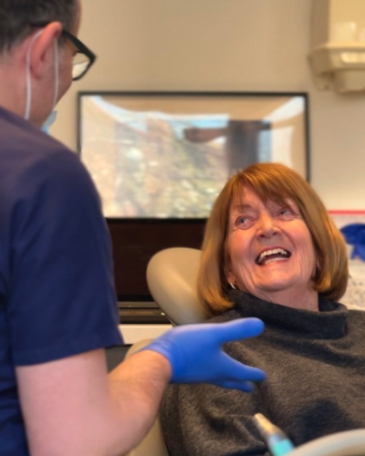 Smiling female patient talking with her dentist during a dental appointment at The Lytham Dental Clinic.