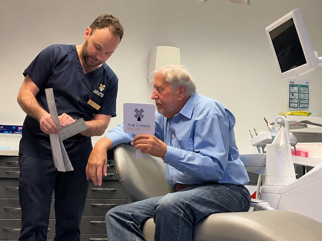 Patient chatting with his dentist during a visit to The Lytham Dental Clinic in Lytham St Annes.