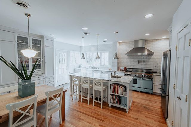 A wider view from one of our kitchen renos&nbsp; that really showcases the storage spaces we designed.&nbsp; Check out the floor to ceiling pantries that are highlighted by some glass-encased shelving! 
It was a big space to work with, but we wanted 