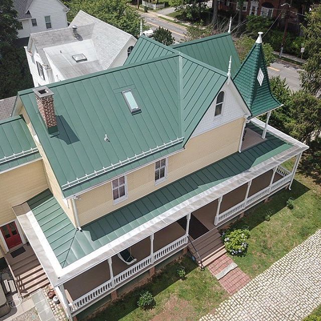 How about an aerial view of a recently finished project? * 
The porch roof on of our longtime clients&rsquo; home had been badly damaged over the years from water getting in. In fact, the damage even affected the original wood siding and some of the 
