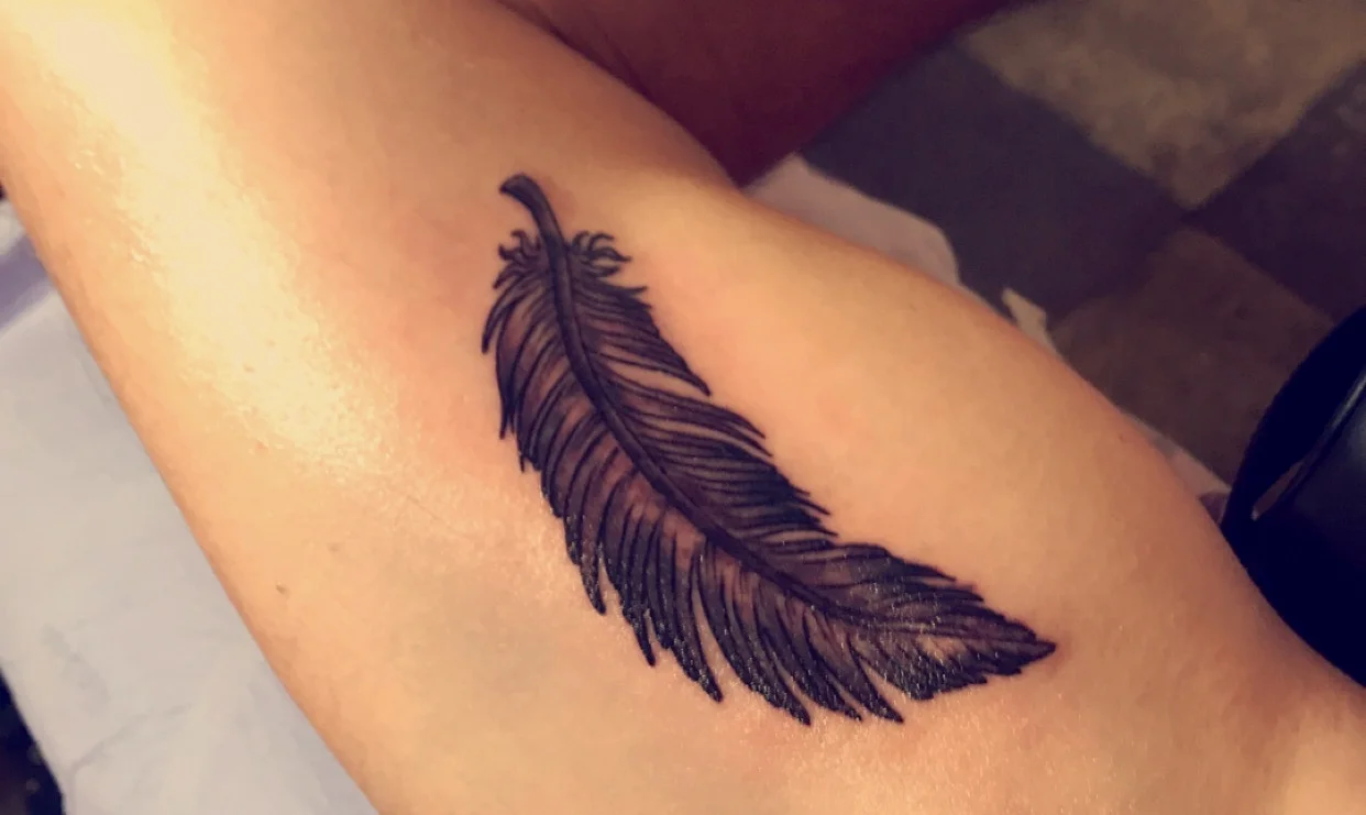 Dad's feather tattoo.jpg