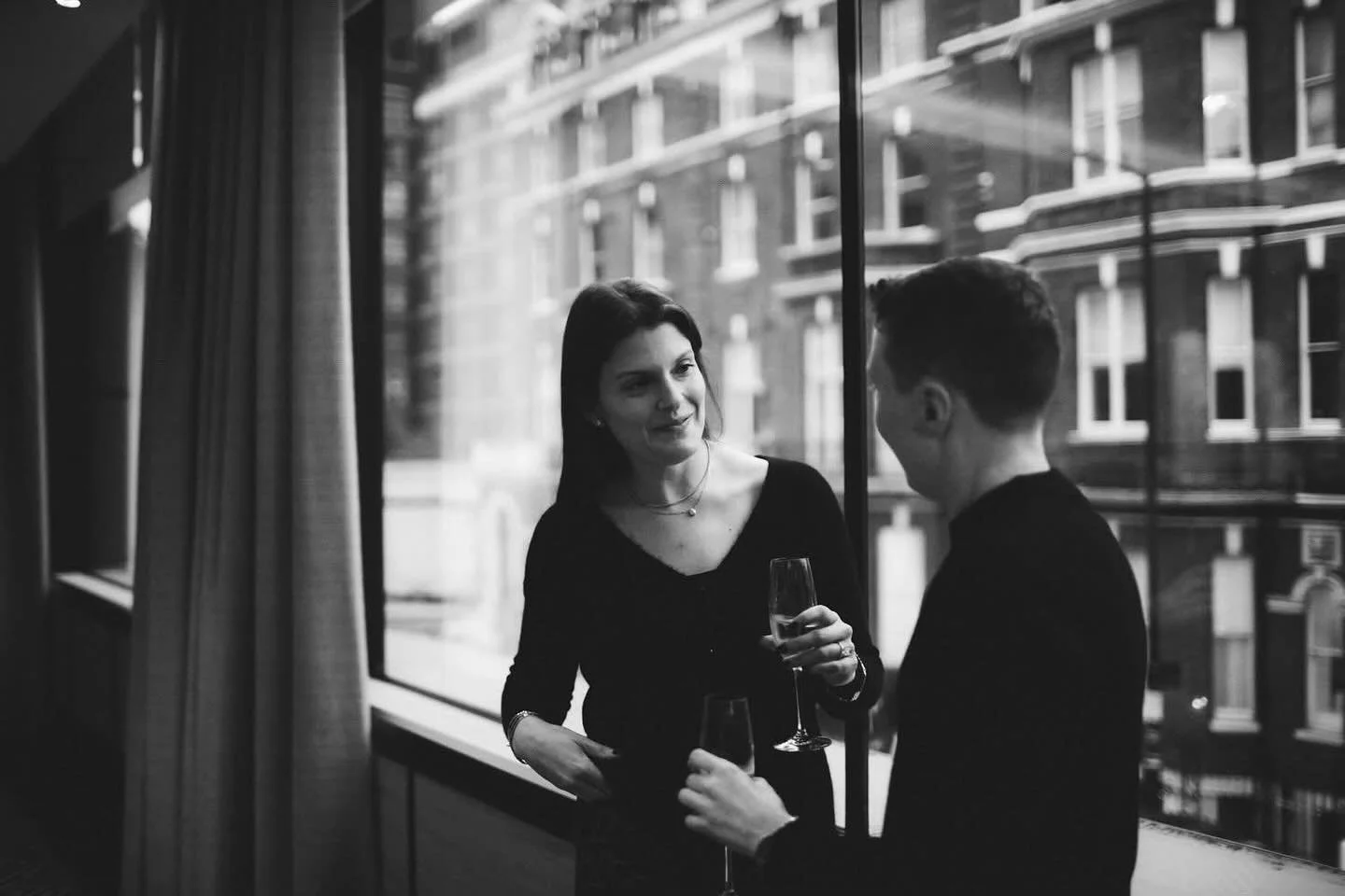 A Quiet Moment After the &ldquo;Yes!&rdquo;

After the secret proposal at the Nobu Hotel in Portman Square, the world seemed to slow down. Hallie and Kelly shared a quiet glass of champagne by the window, the beautiful soft autumn light falling aroun