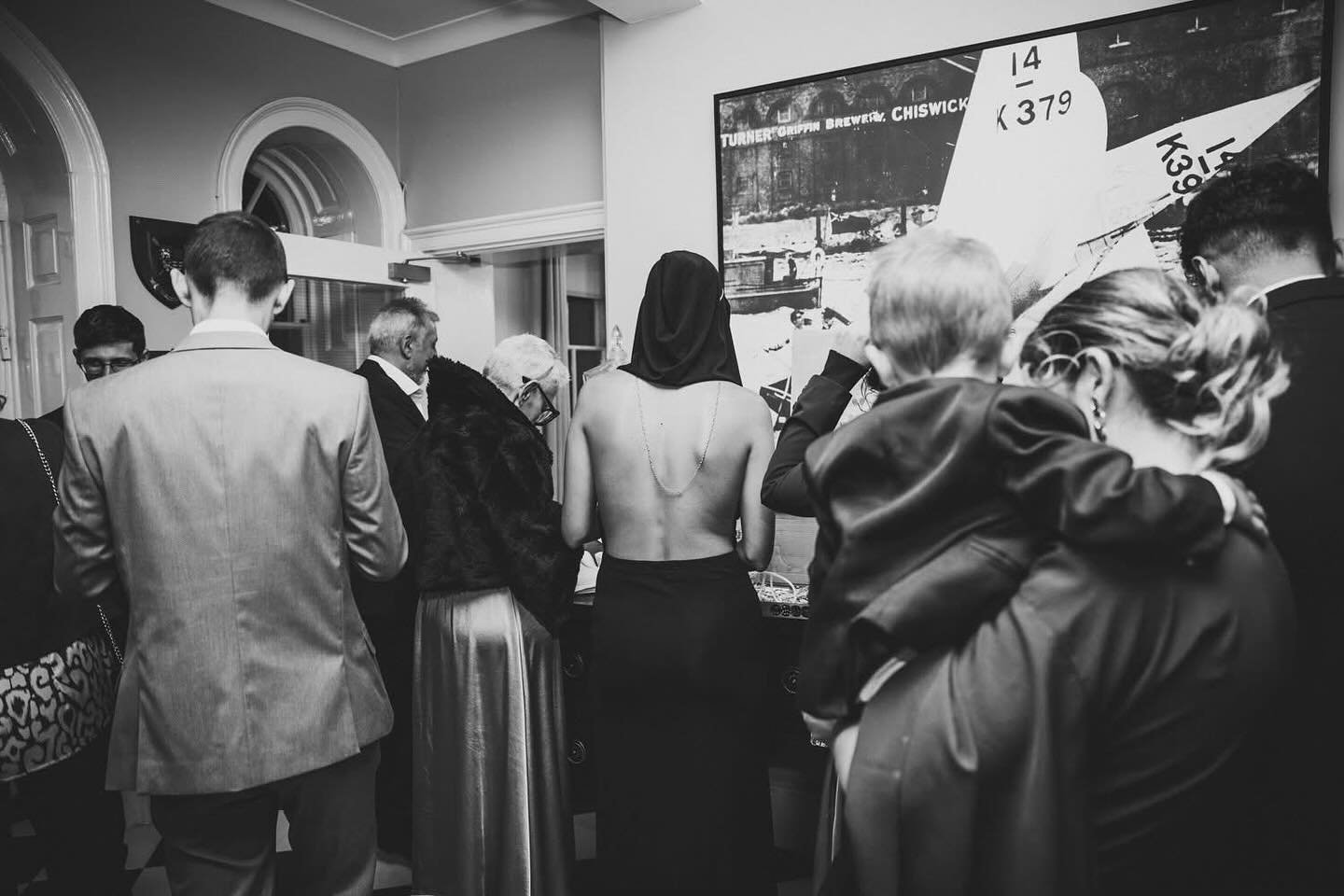 There are moments during a wedding that feel almost like paintings &mdash; quiet, mysterious, and full of stories waiting to be discovered.

This black-and-white image from Ania &amp; Andrea&rsquo;s autumn wedding at Linden House in London is one of 