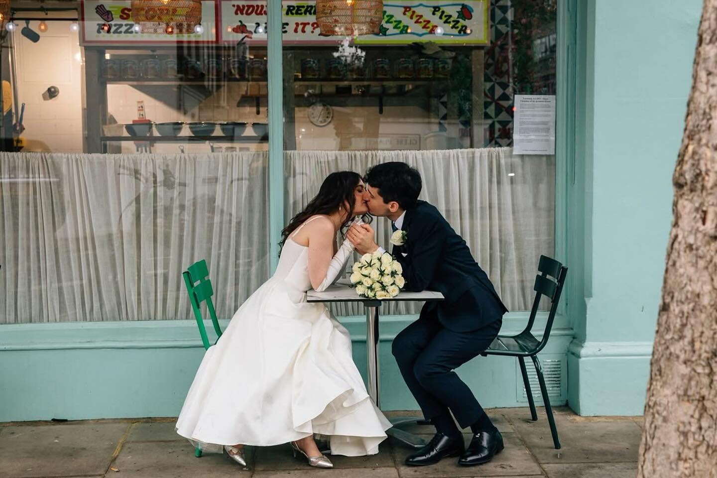 Rebecca &amp; Giacomo looked as if they&rsquo;d stepped straight out of a 1960s Italian film, kissing at a little table in a Chelsea restaurant with those soft pale green walls behind them. Their Chelsea Town Hall wedding was intimate, warm, and beau