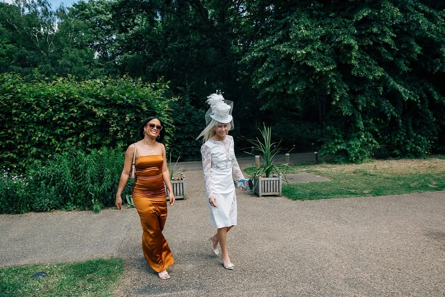 Bride and daughter walking through the grounds at Orleans House Gallery