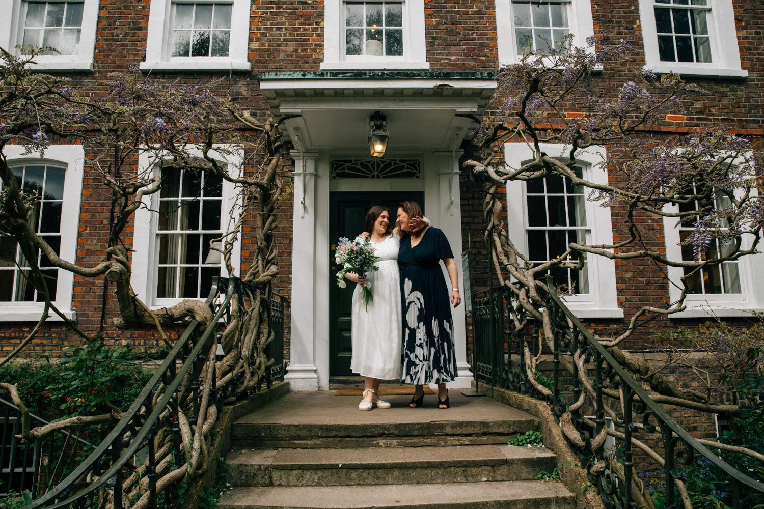 Newly married couple outside the entrance of Burgh House in Hampstead