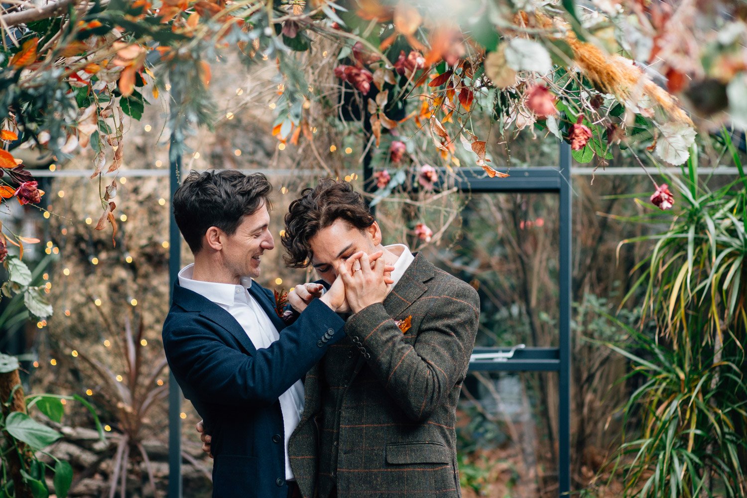Couple sharing a joyful moment surrounded by plants at The Greenhouses in Marylebone