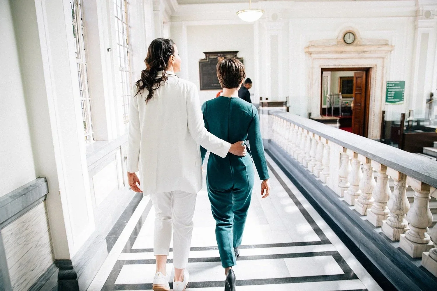 Two brides walking together at their London wedding