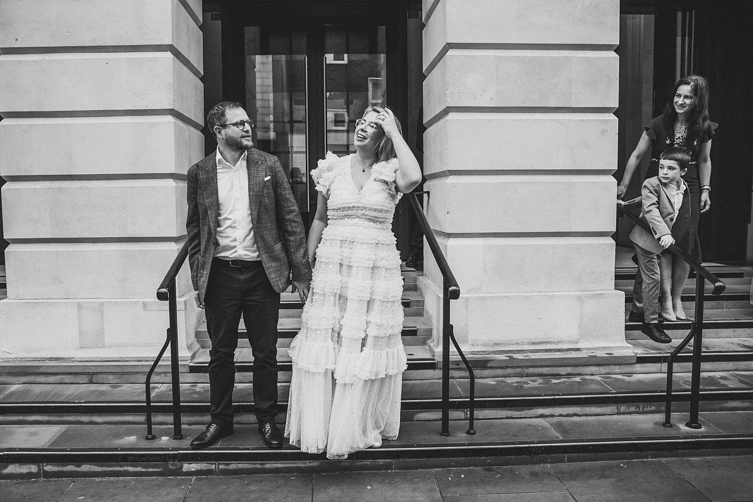 Newly married couple and their children outside Camden Town Hall