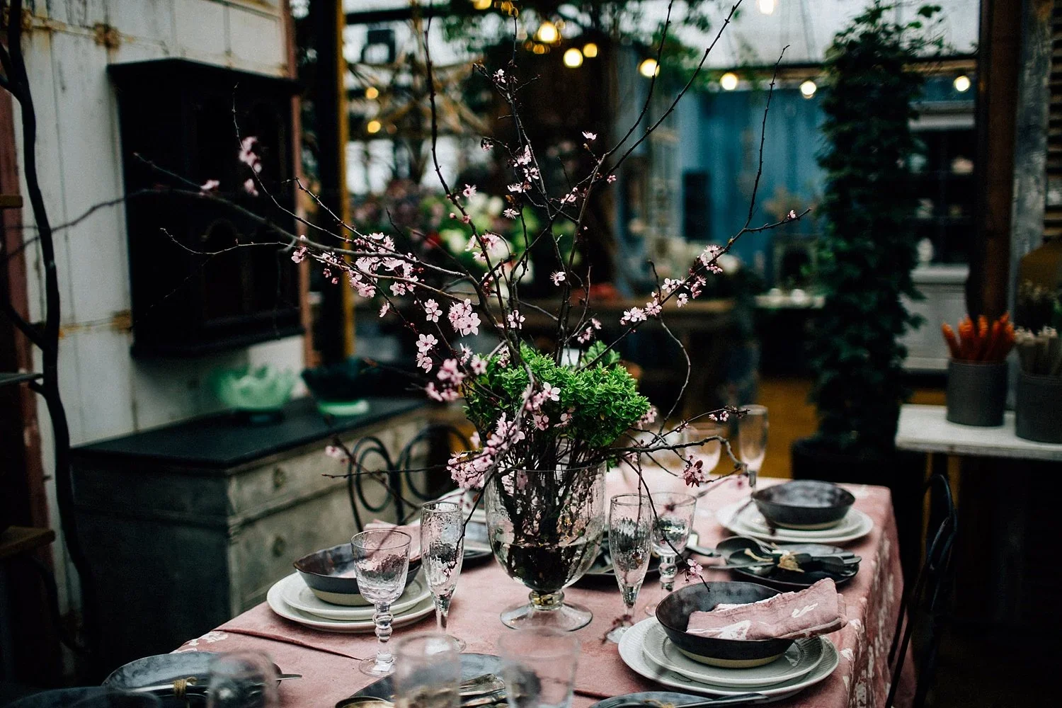 Beautiful table setting surrounded by plants and flowers at Petersham Nurseries in Richmond