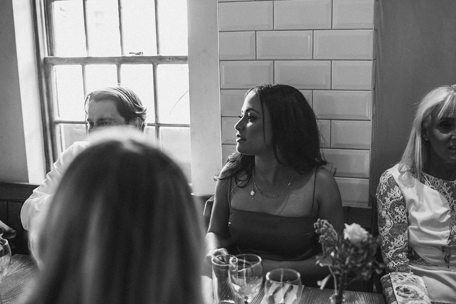 Black and white photo of a wedding celebration at Osteria Pulcinella in Twickenham