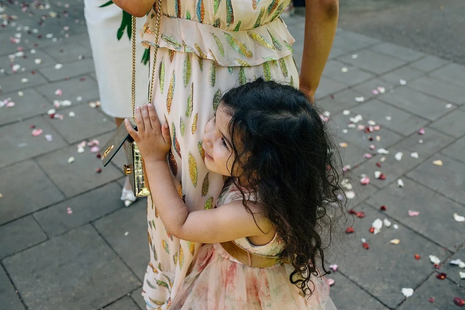 Young wedding guest holding her mother after the Orleans House Gallery wedding