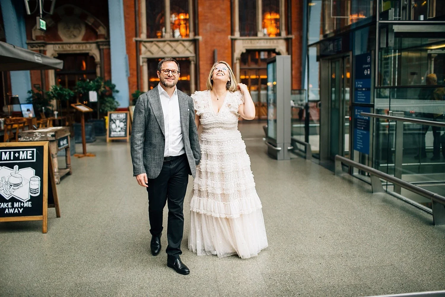 French newlyweds walking through London after their intimate Camden Town Hall wedding