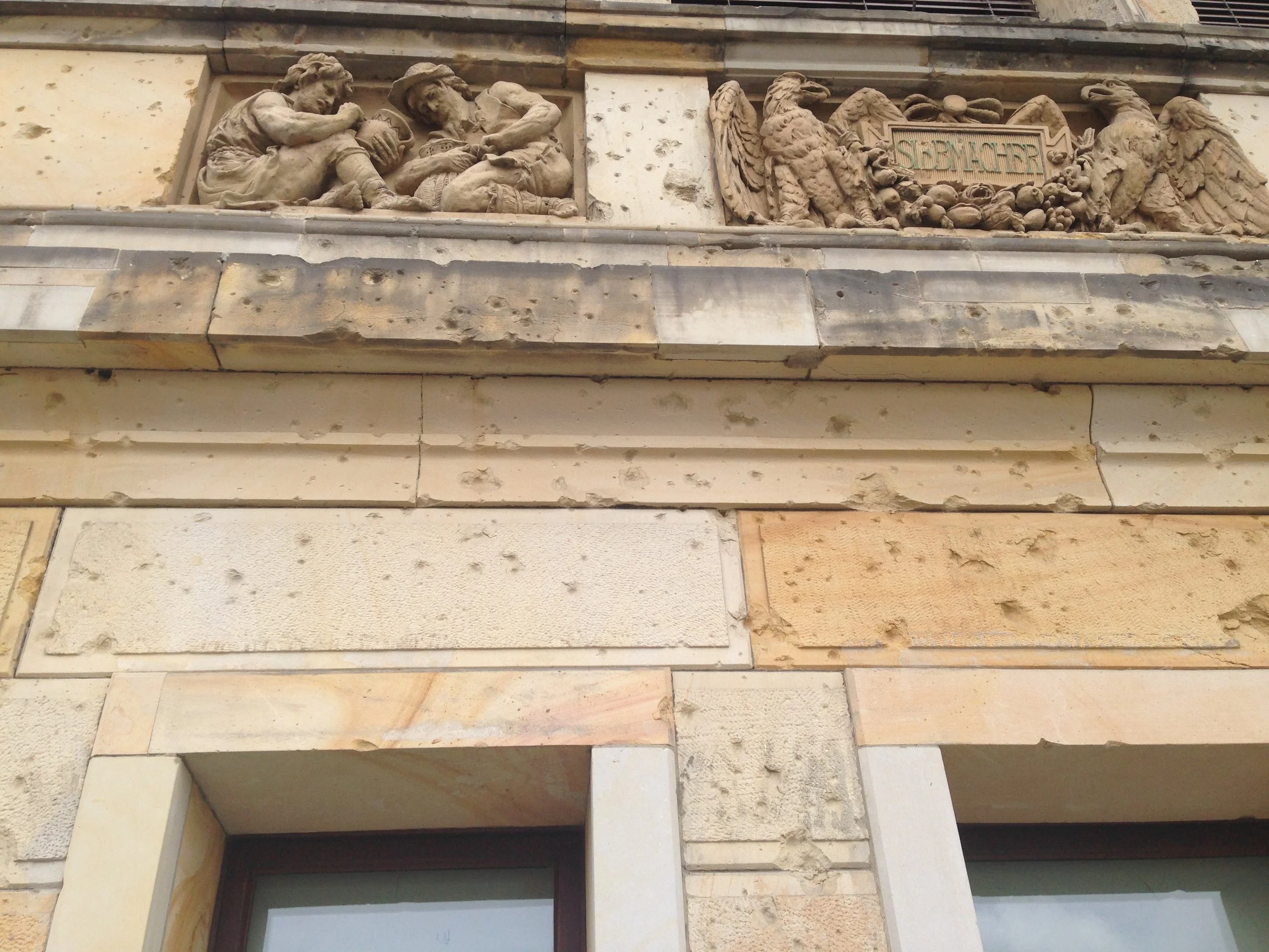 Each building in Berlin shows scars from the carnage of WW2.