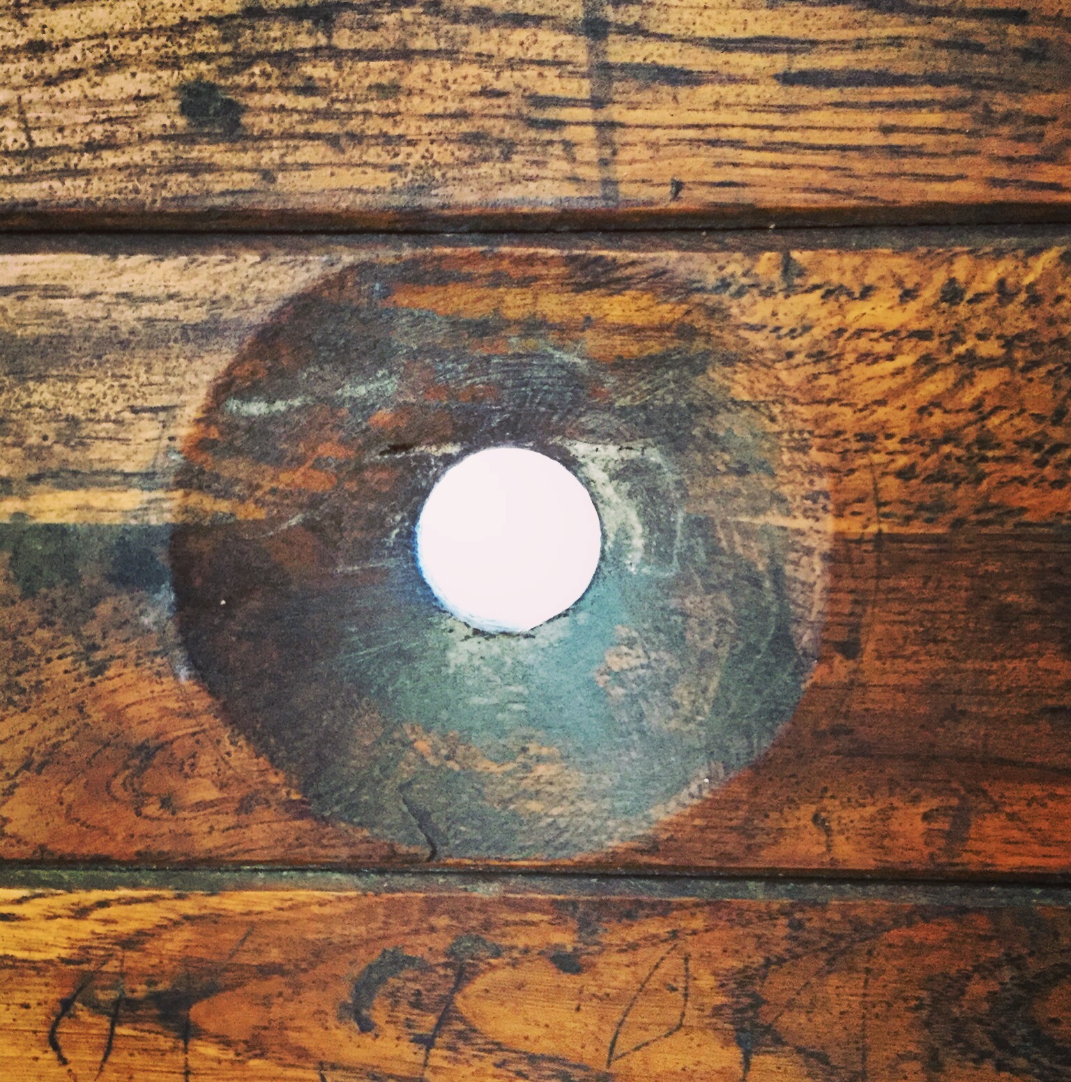 Cell door, viewing hole. 