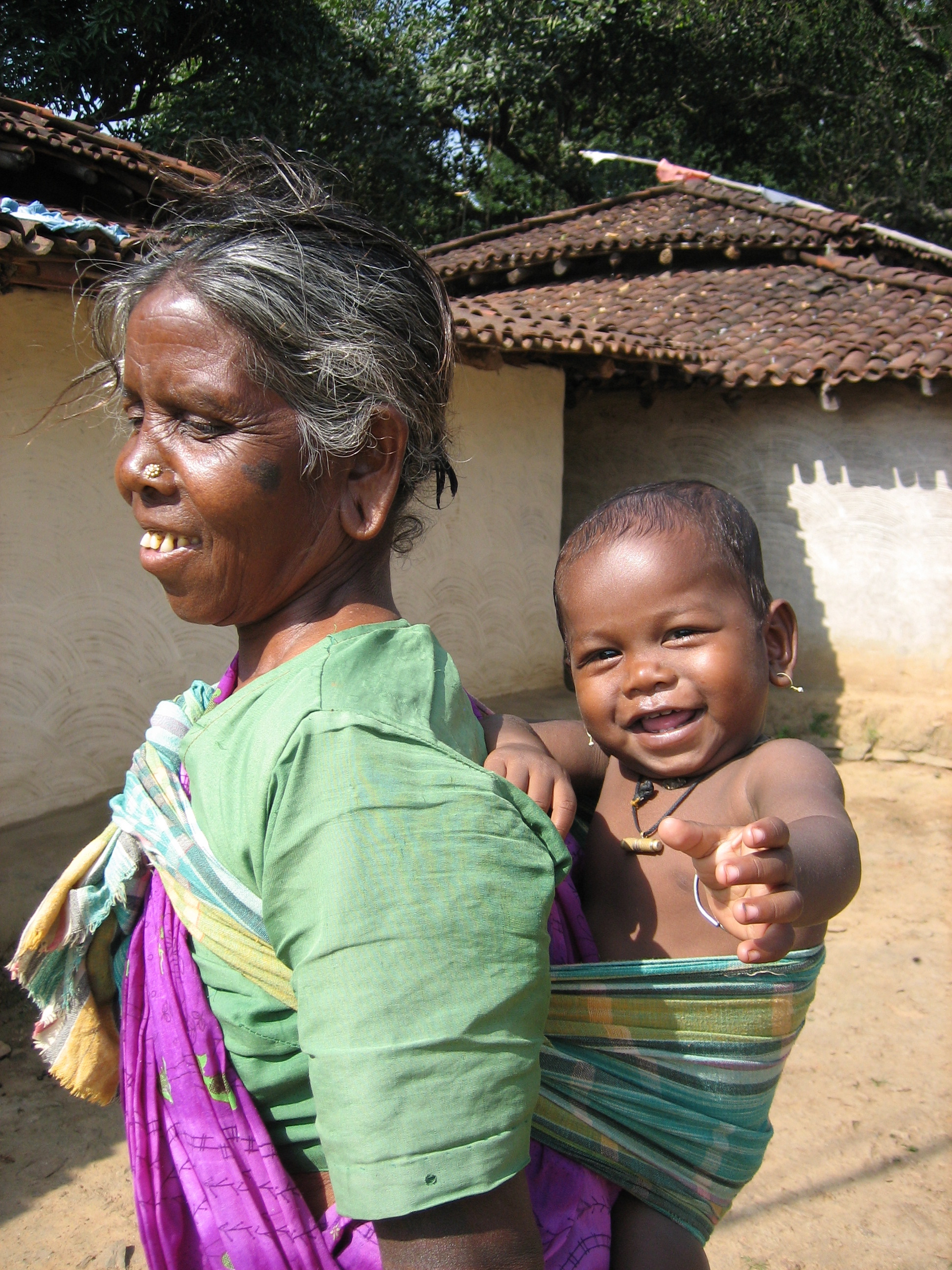 C6 Munda Adivasi grandmother carrying her grandson.jpg