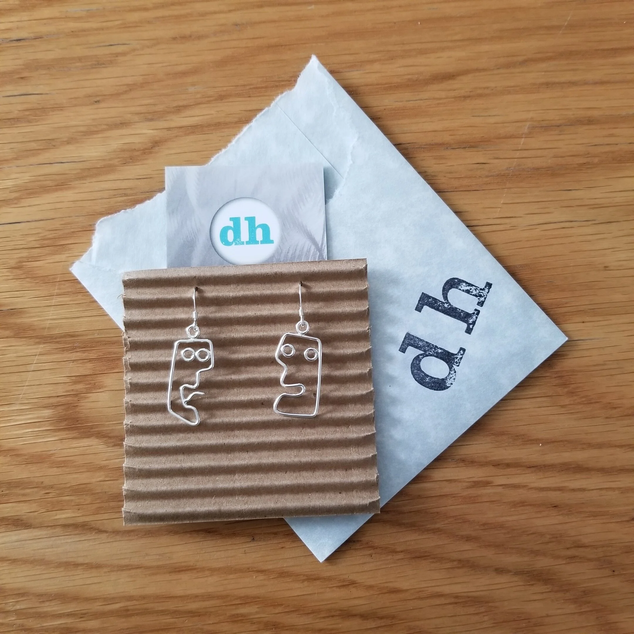 sterling silver face earrings