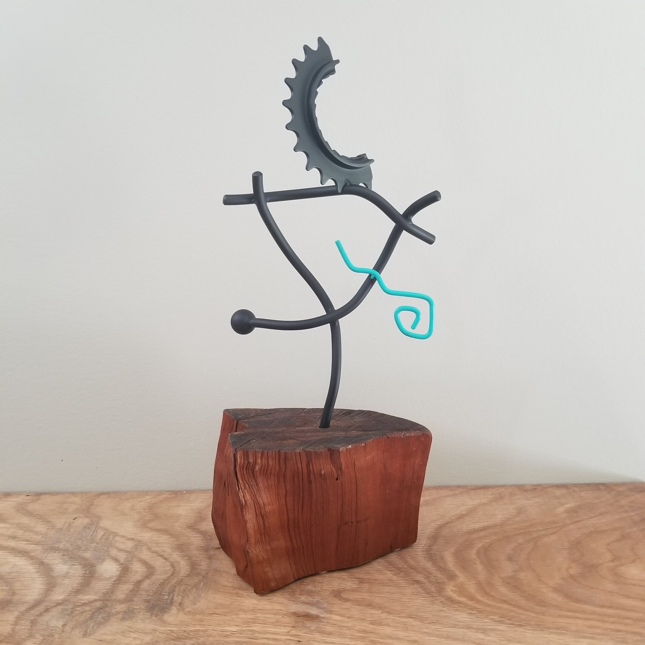 "desert sky" small metal sculpture on red oak