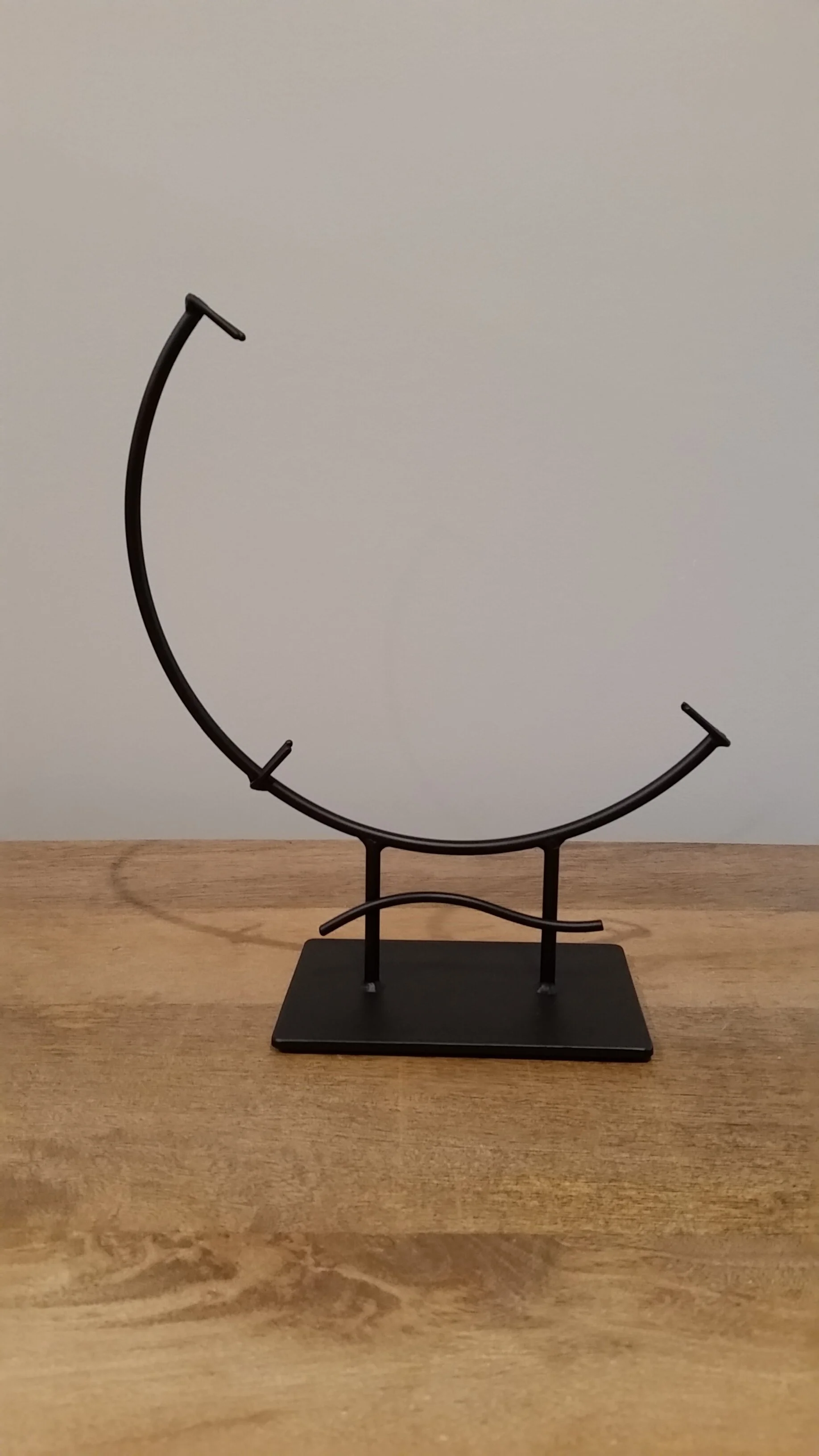 12" black glass display stand with single wave design — dave hardell