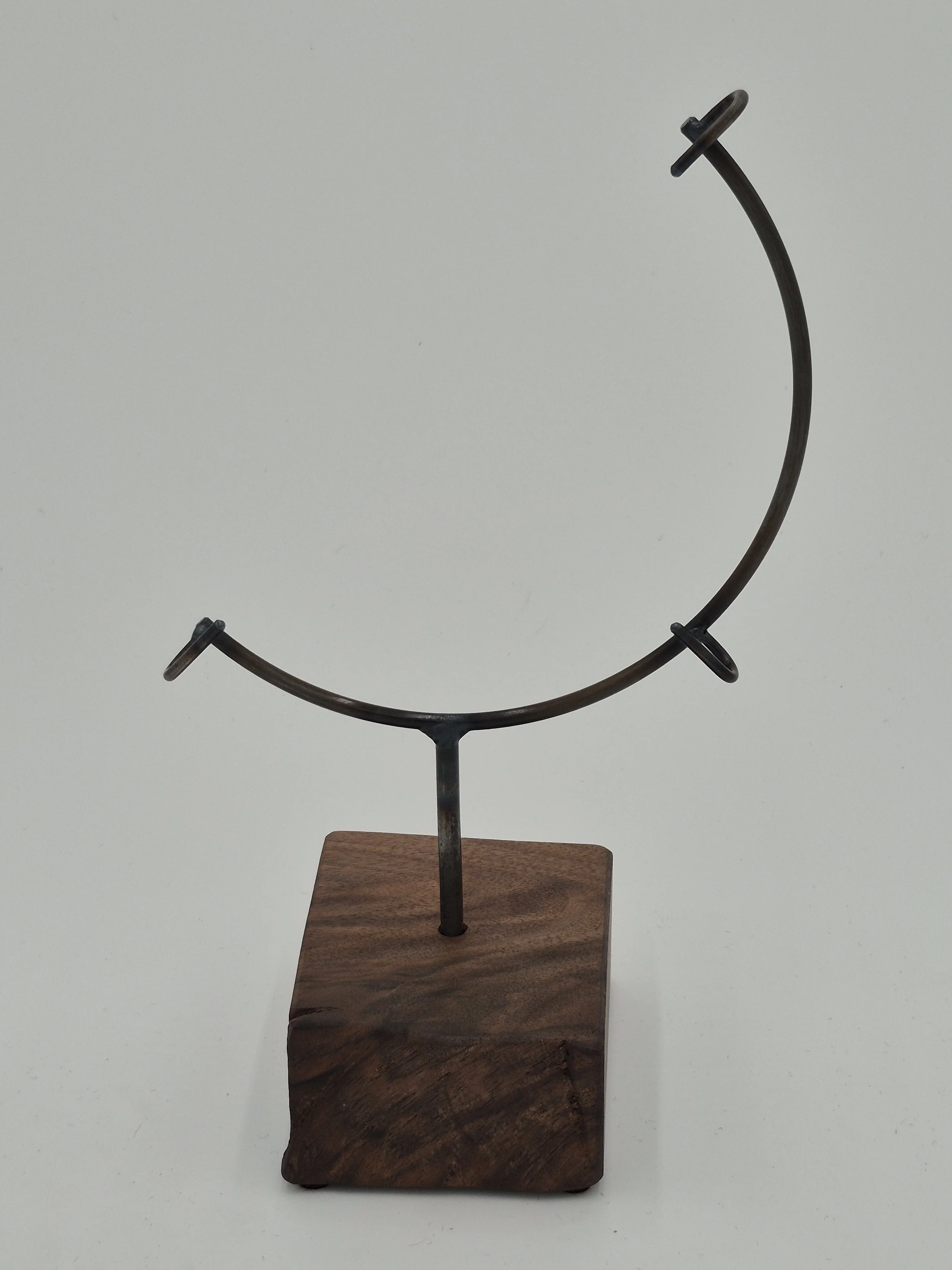 8" round glass stand on black walnut