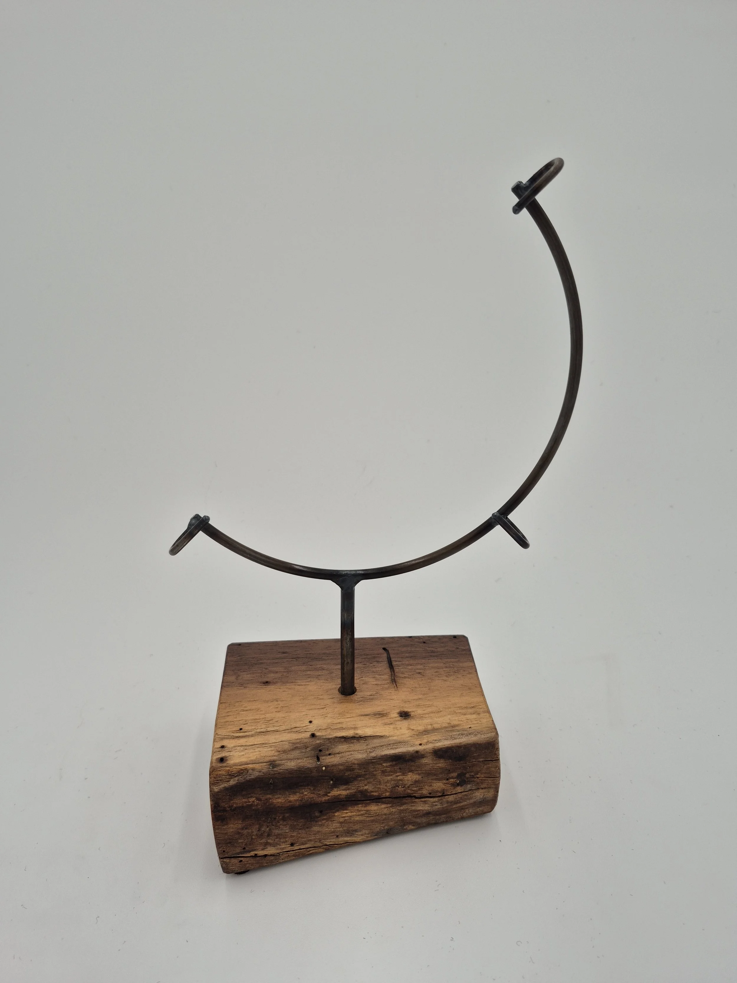 8" round glass stand on black walnut