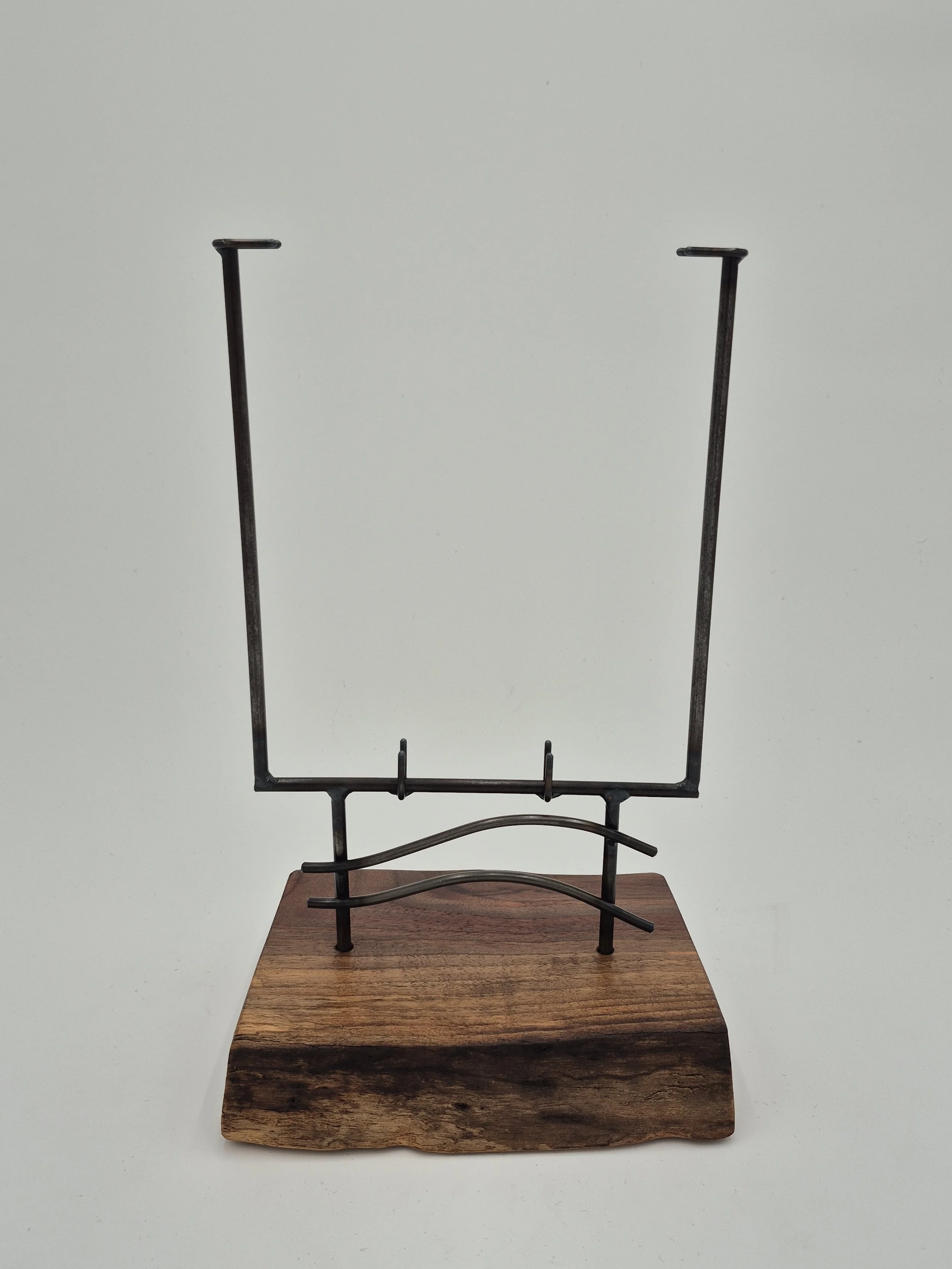 7" w x up to 12" h glass stand on black walnut