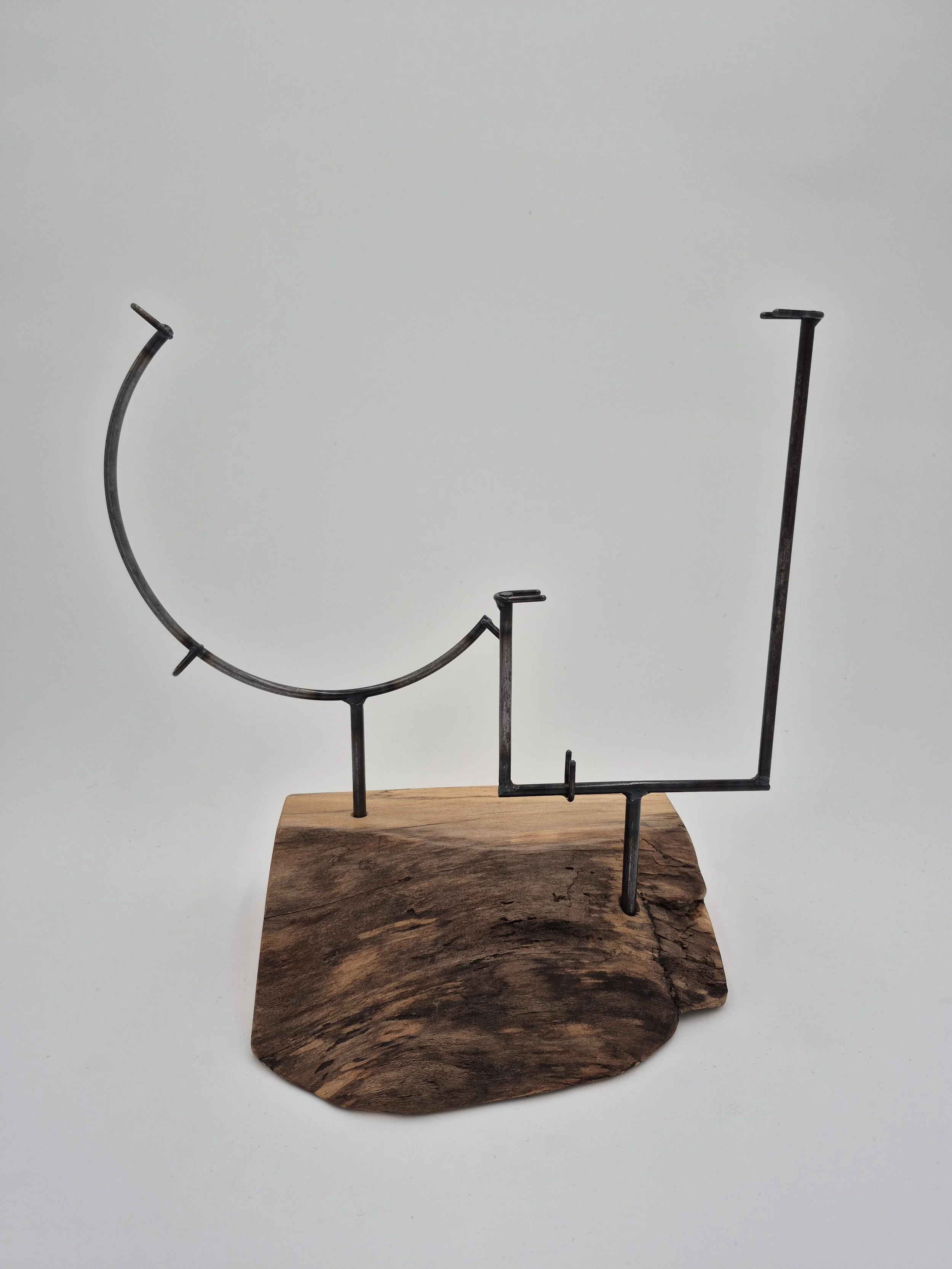 one 10" round, one 4"w x 12"h glass stands on live edge maple