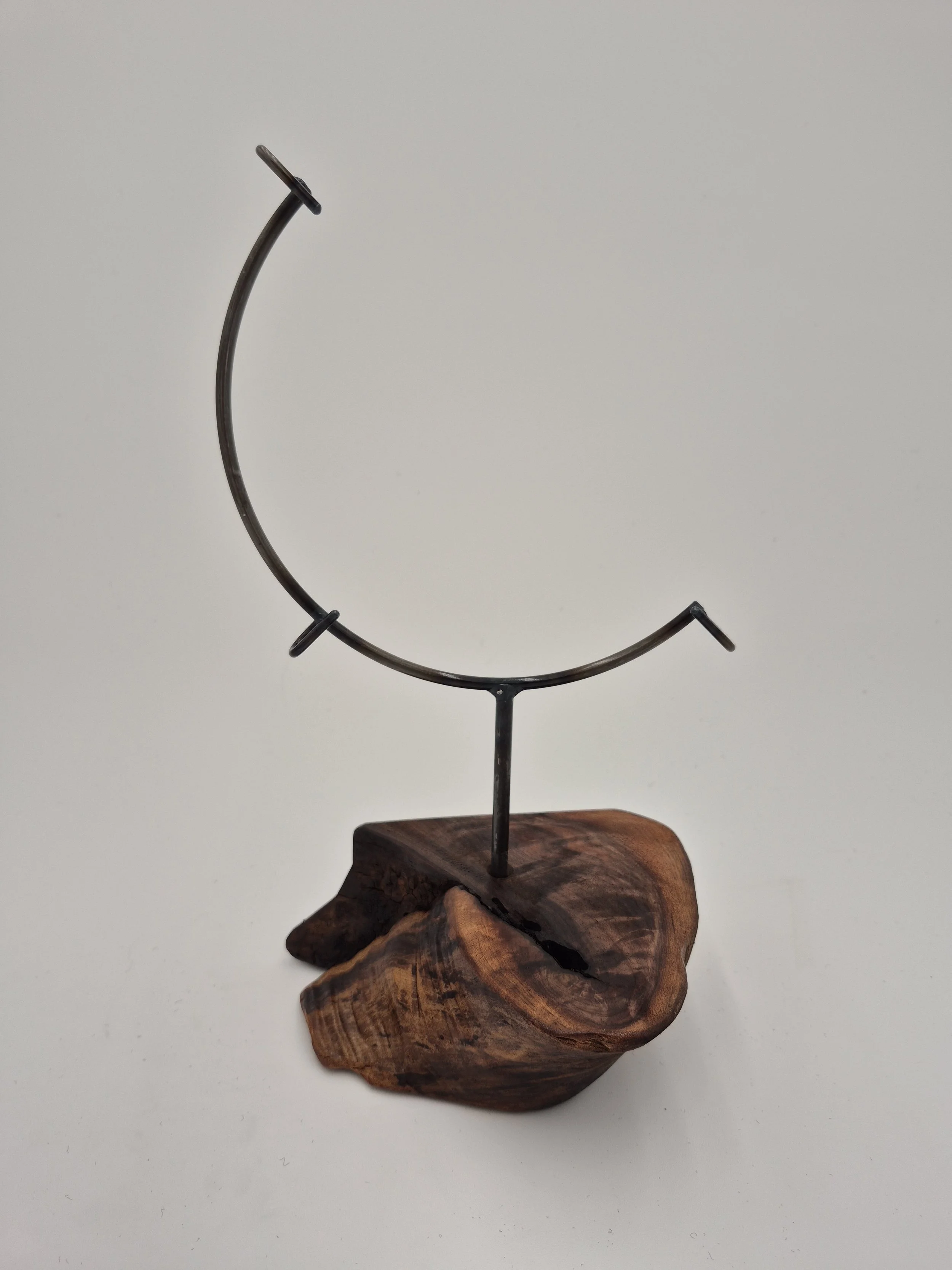 8" round glass stand on black walnut