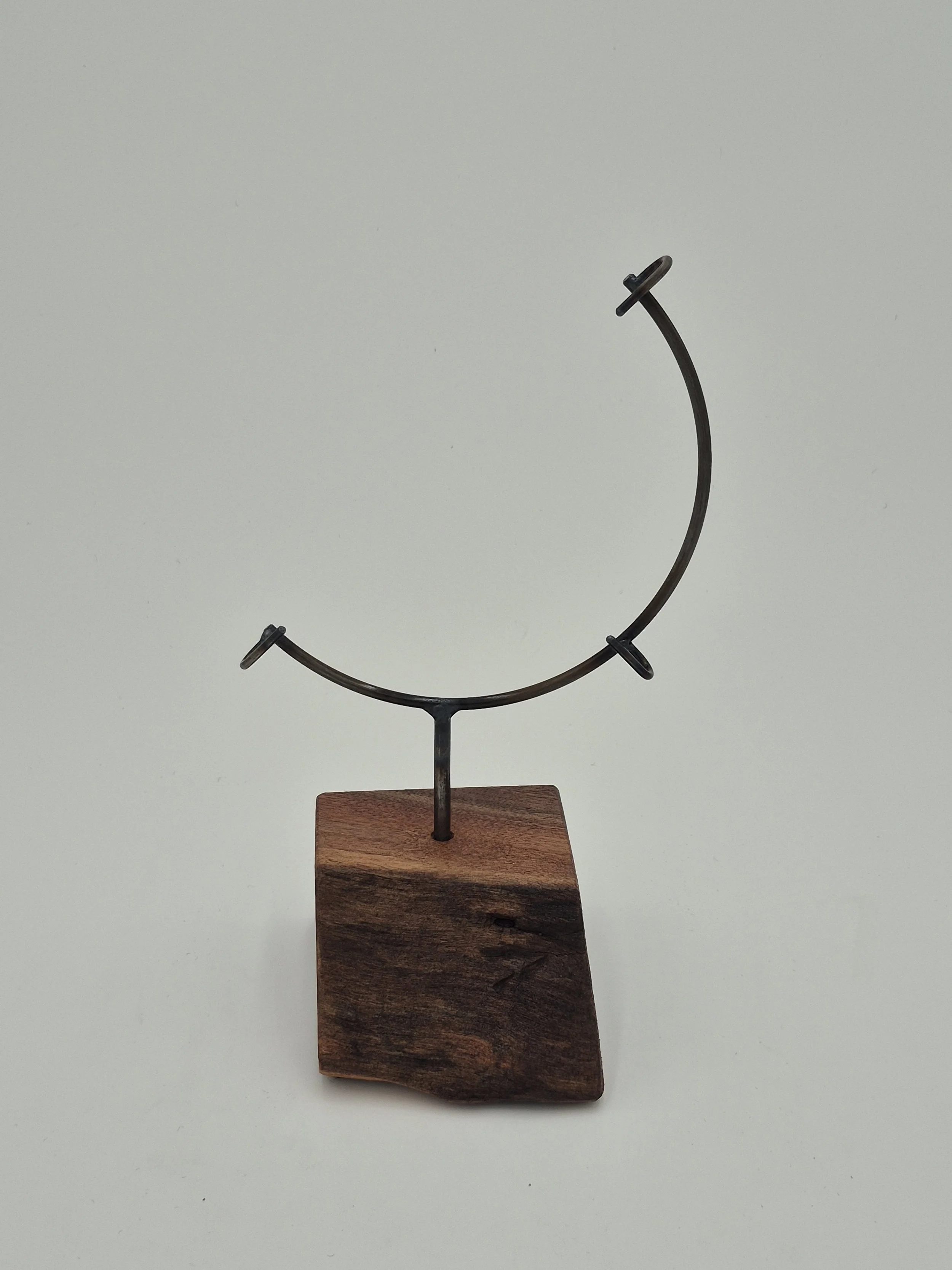 8" round glass display stand on black walnut