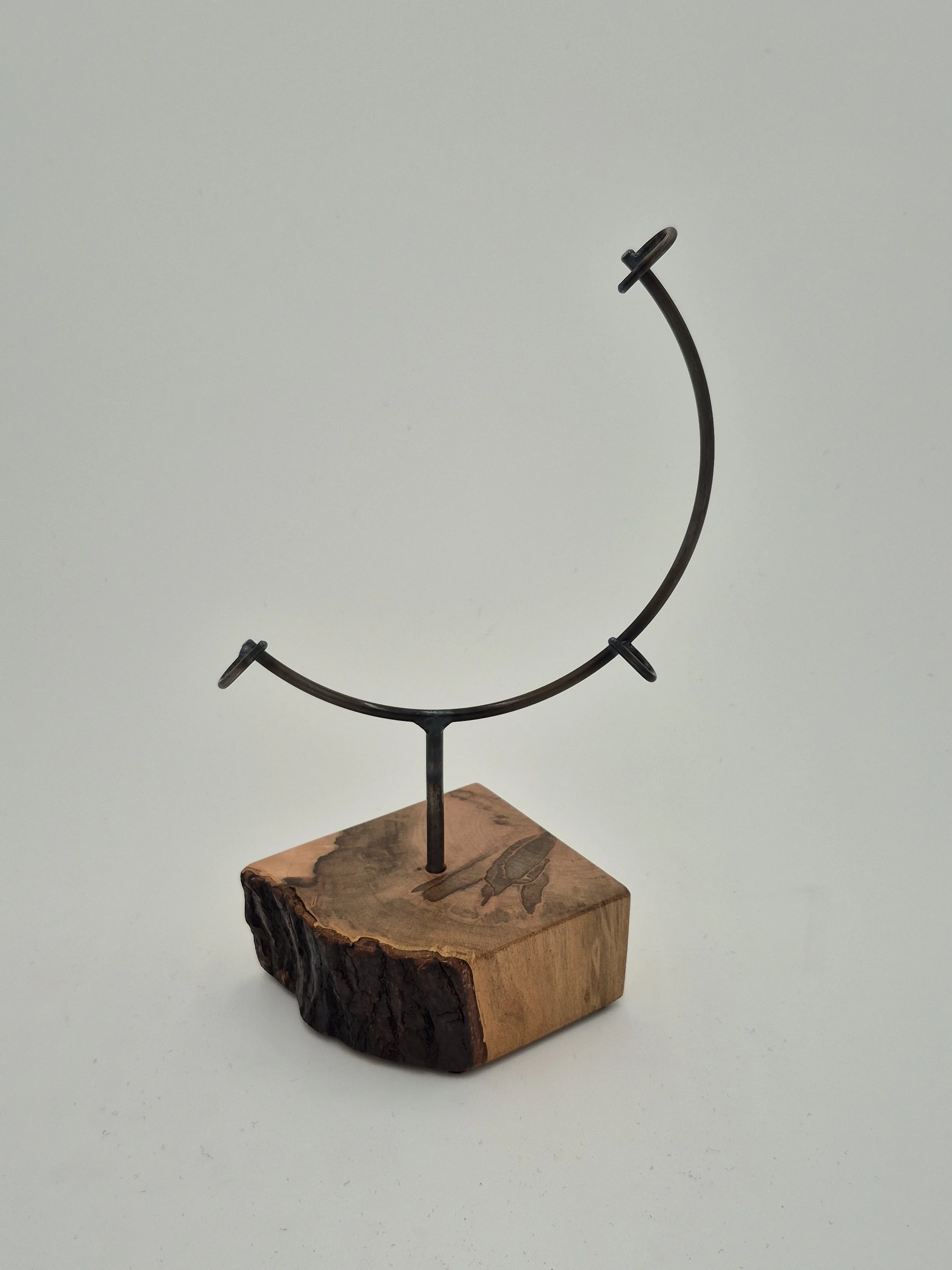 8" round glass display stand on ambrosia maple