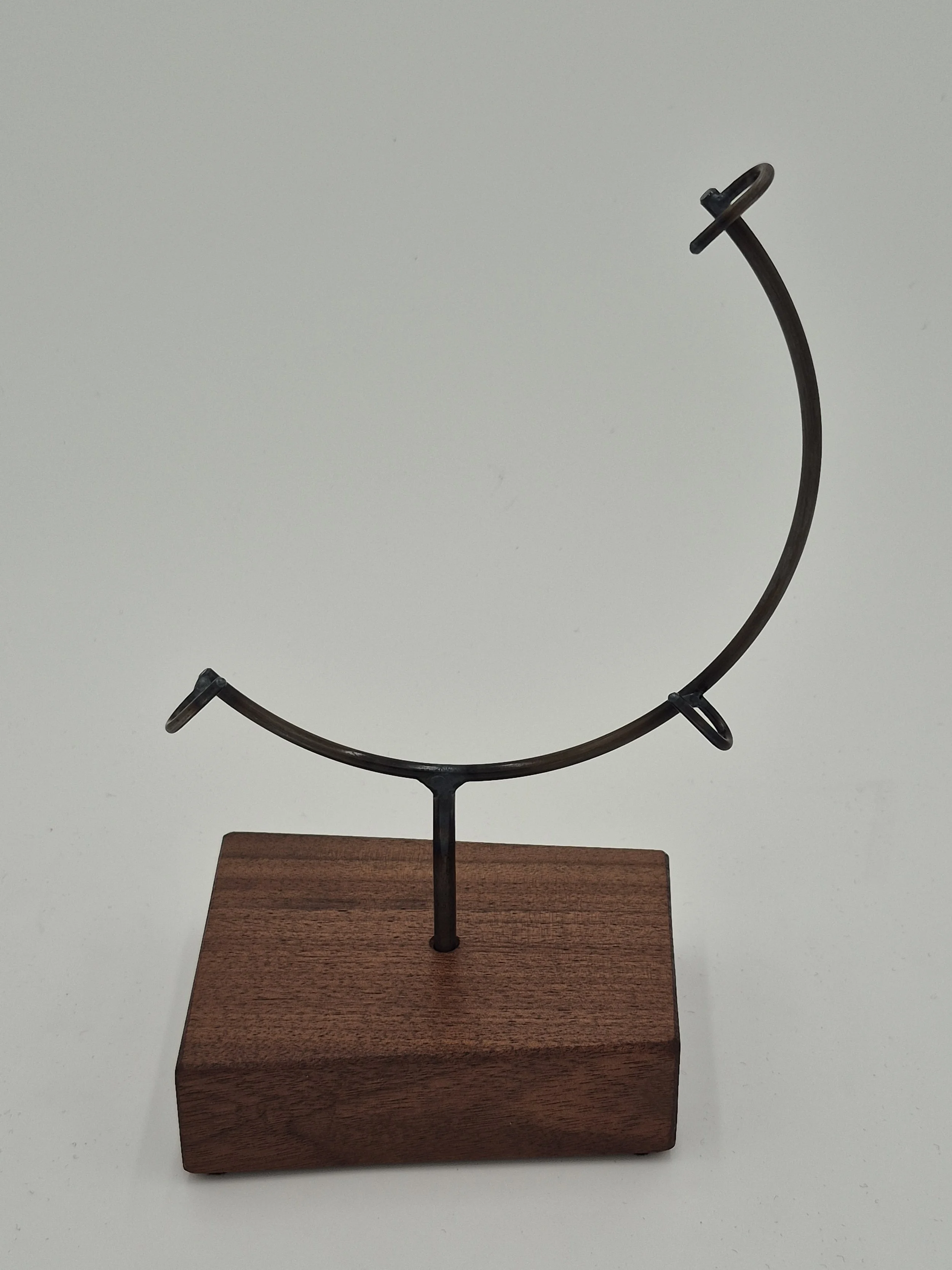 8" round glass stand on black walnut