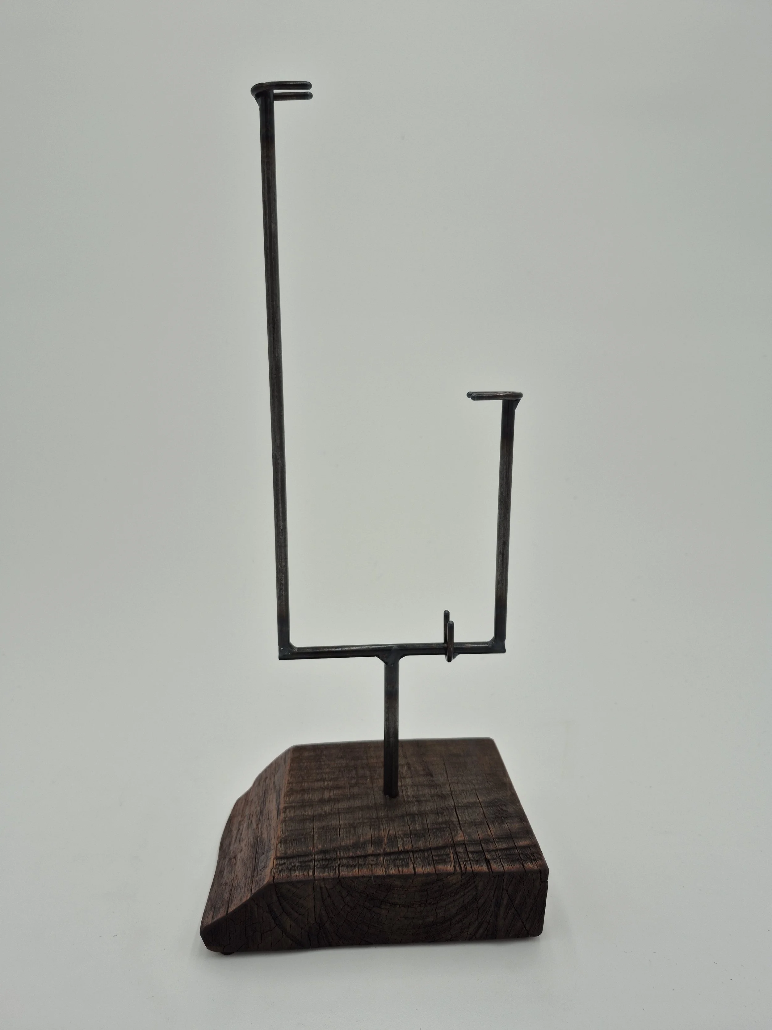 12" x 4" glass stand on black walnut
