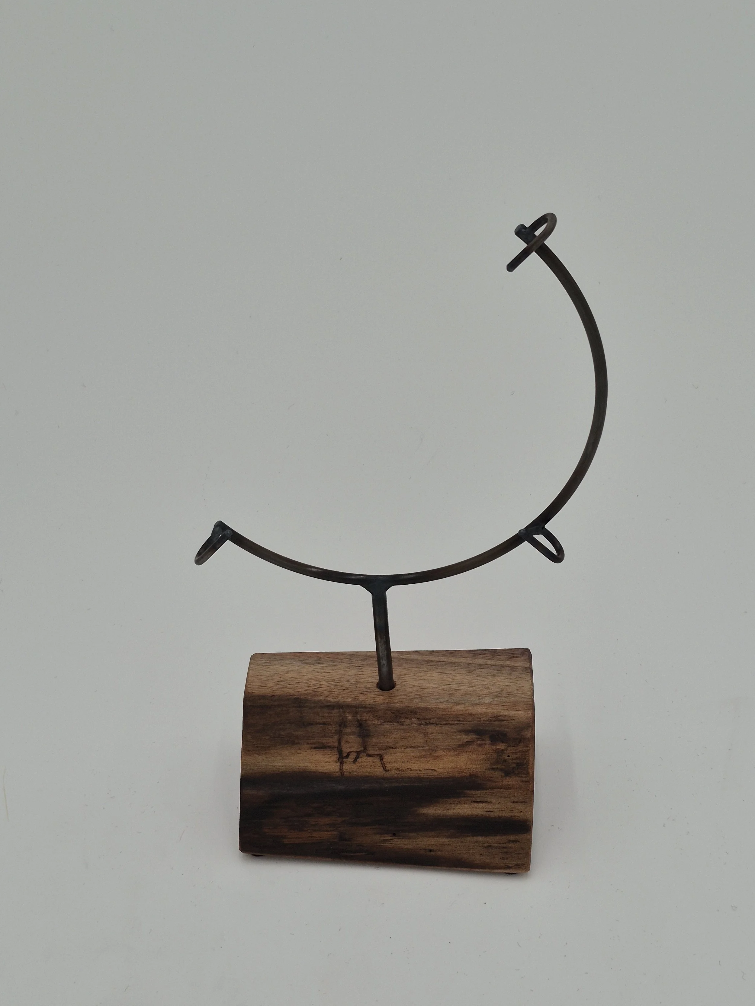 8" round glass stand on black walnut