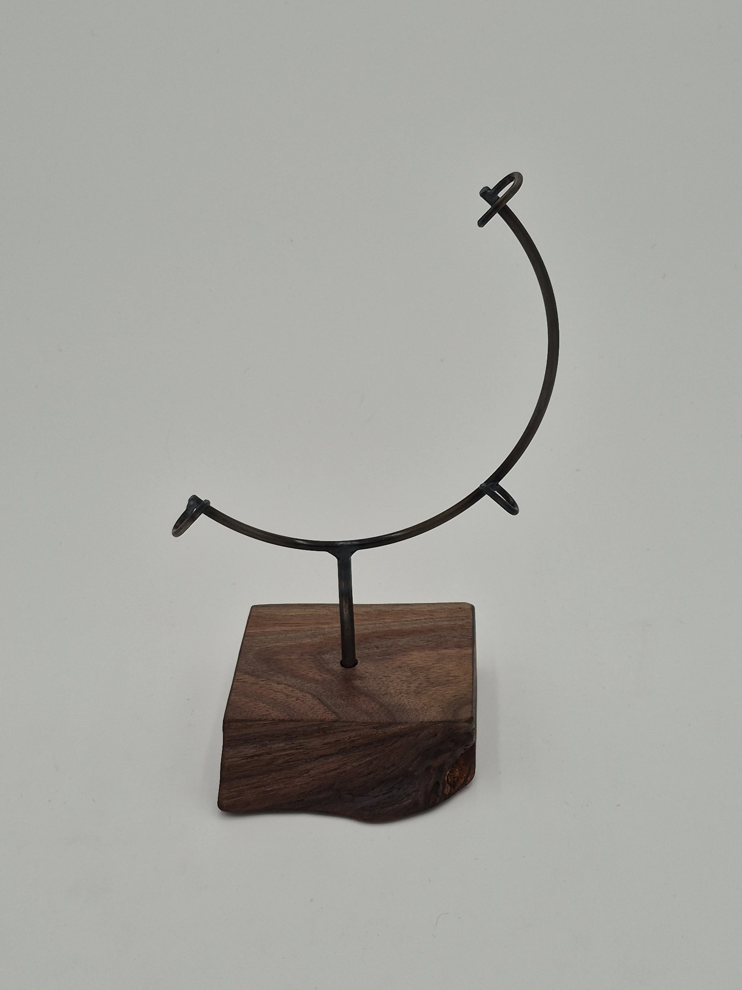8" round glass display stand on black walnut