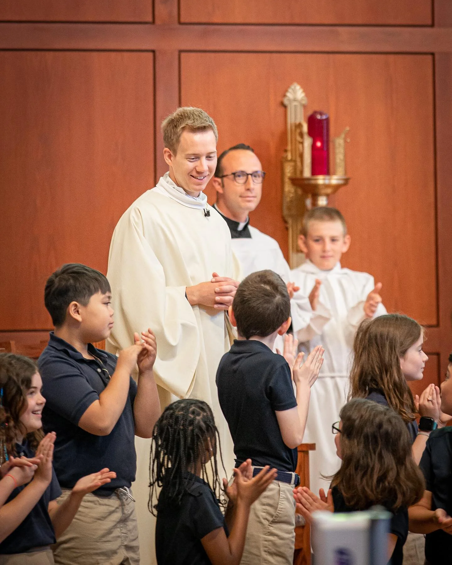 Holy Cross School students prayed over soon-to-be Rev. James Buttner during Mass today. James will be ordained to the priesthood on Saturday, June 3. Congratulations James! We&rsquo;re praying for you!