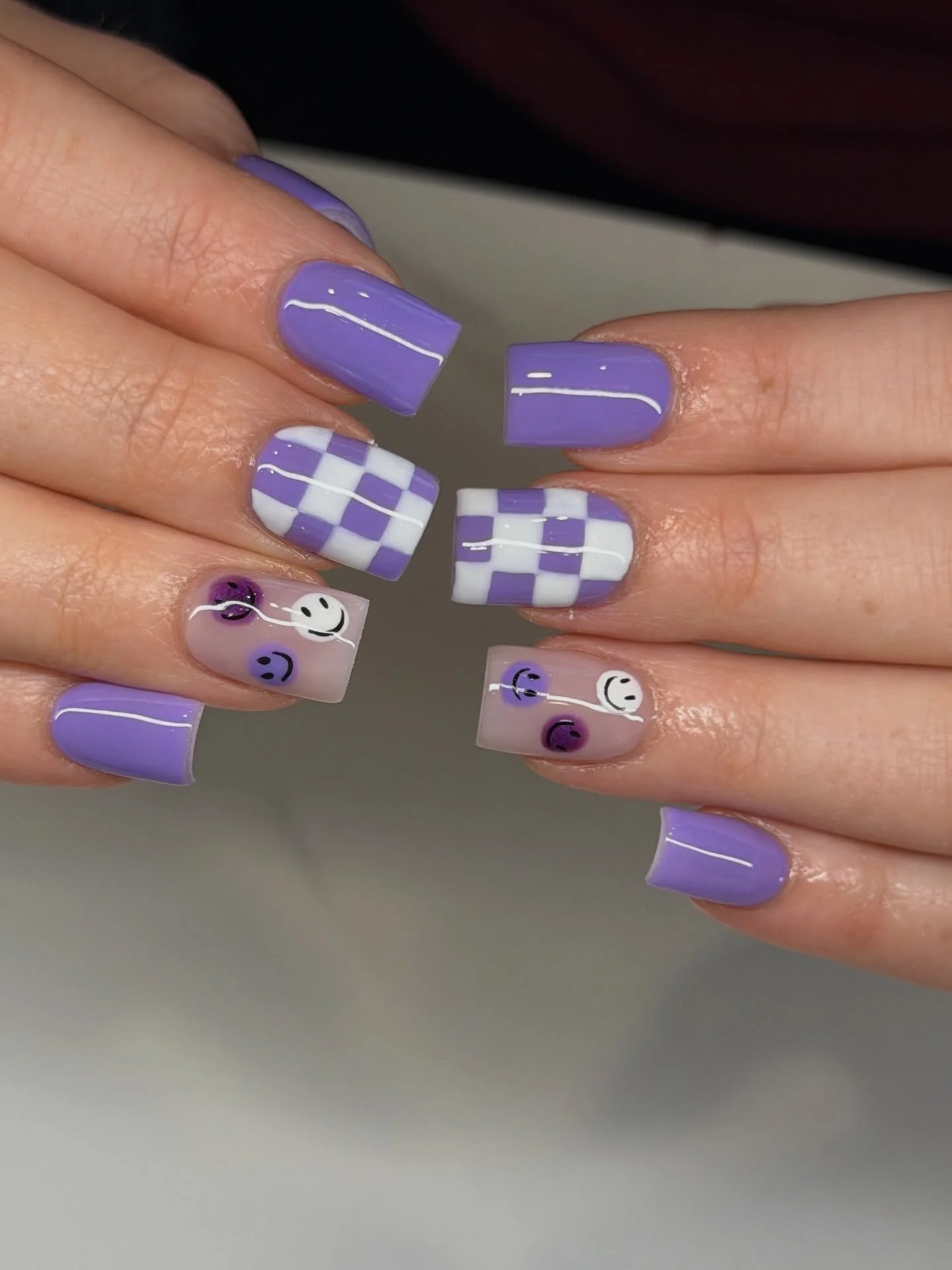 Pastel season is here 💜🐣

Ashley created this playful pastel purple spring set just in time for Easter &mdash; featuring glossy lavender nails, a fun checkerboard accent, and cute smiley details for that soft retro vibe.

It&rsquo;s giving spring n