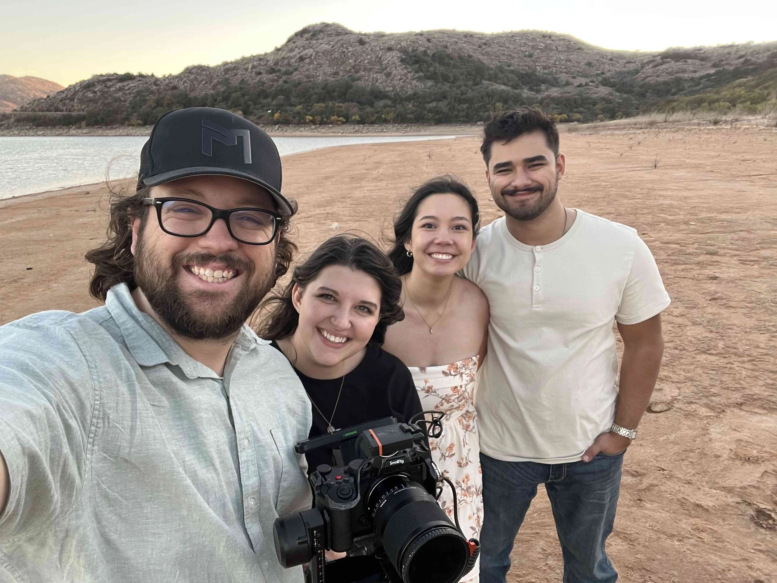 Standing by lake shower 4 people dressed nicely