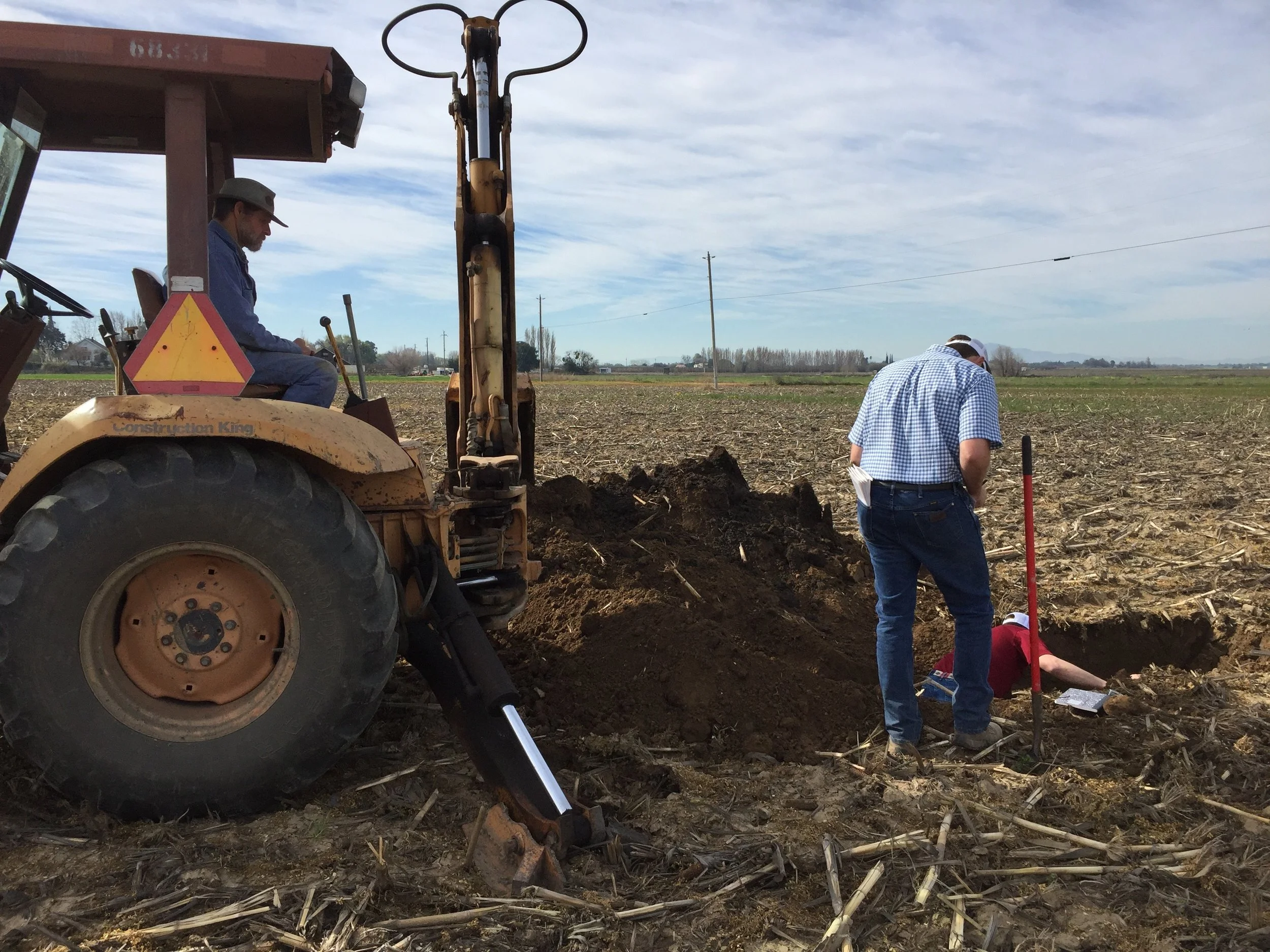 Digging holes to take soil samples