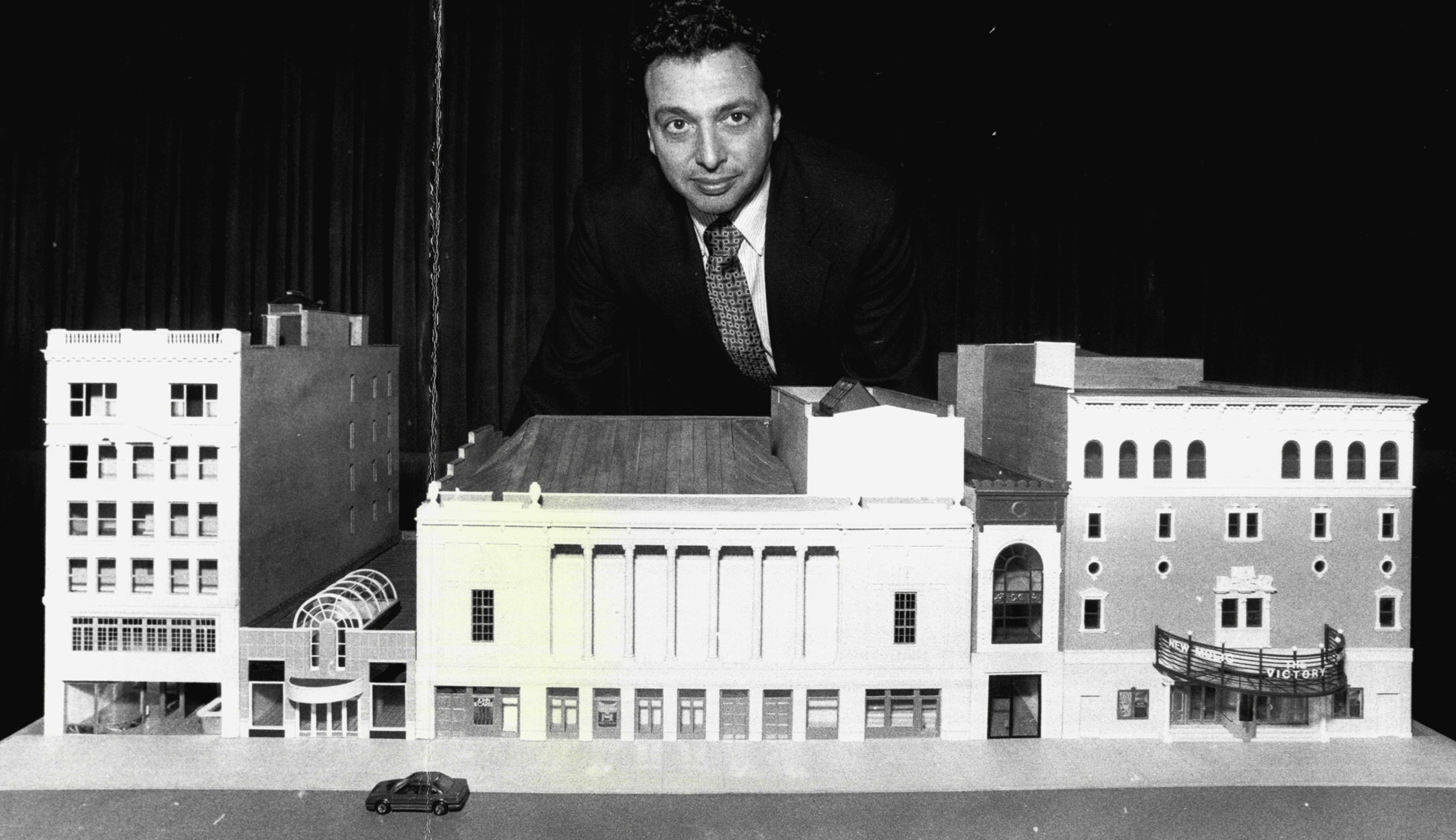 Douglas Durst stands behind a scare model of the Times Square Theatre and New Victory Theater. The Durst Organization would eventually build the first building as part of the 42nd Street Development Project, across the street at 4 Times Square. Credit: Getty Images