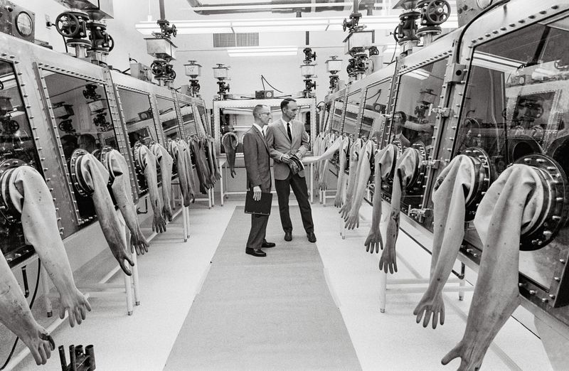 Apollo 11 Command Module Pilot Michael Collins inspects NASA's Lunar Receiving Laboratory at the Manned Spacecraft Center in Houston, where rock samples collected by Apollo were analyzed. (NASA)