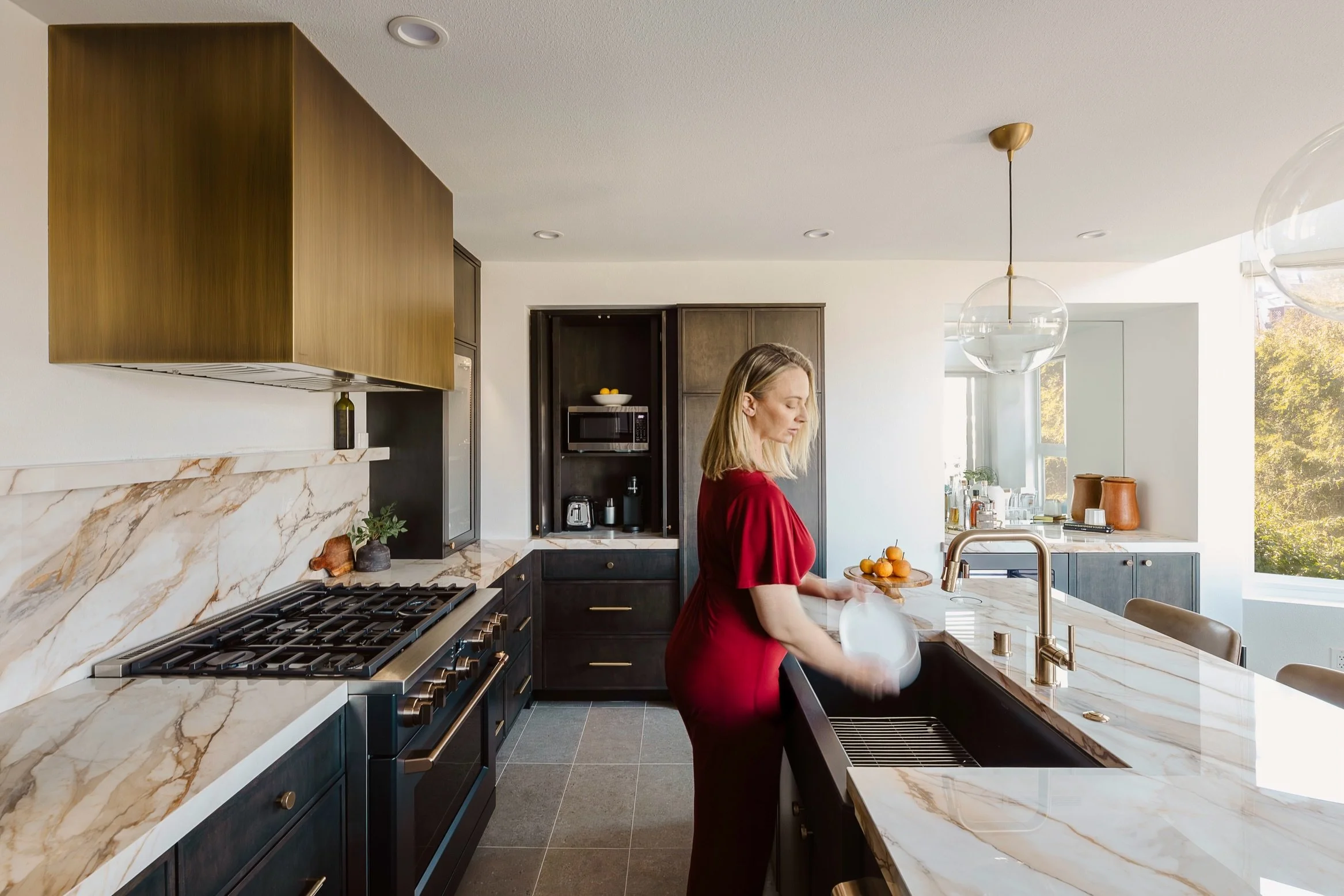 Dark cabinetry, dramatic stone, and a brass hood, this kitchen wasn&rsquo;t designed to blend in.

Marina del Rey Remodel / Marina del Rey, CA

Photos: @r.j.guillermo 

Kitchen remodel &bull; Custom cabinetry &bull; Statement stone &bull; Waterfall i