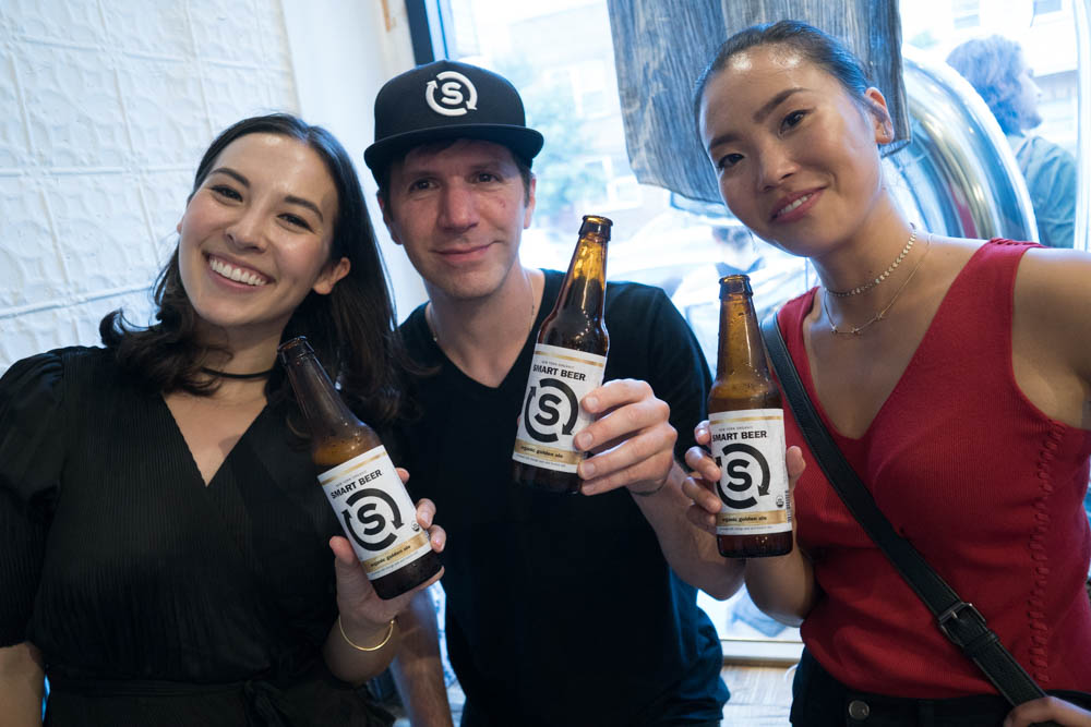 Gabriel Heymann with two fans of his Smart Beer