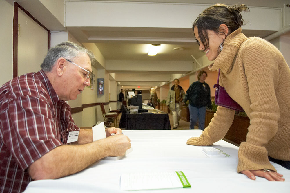 Howard Lyman signs books at Farm Sanctuary's Farm Animal Forum