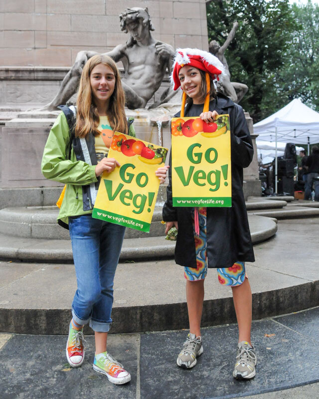 Go Veg! girls by Columbus Park statue